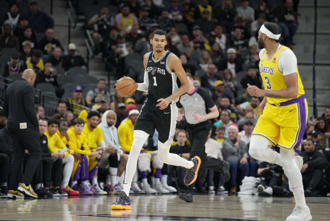 San Antonio Spurs center Victor Wembanyama (1) dribbles the ball in front of Los Angeles Lakers forward Anthony Davis (3) in the first quarter at the Frost Bank Center in San Antonio, Texas, Dec 13, 2023.