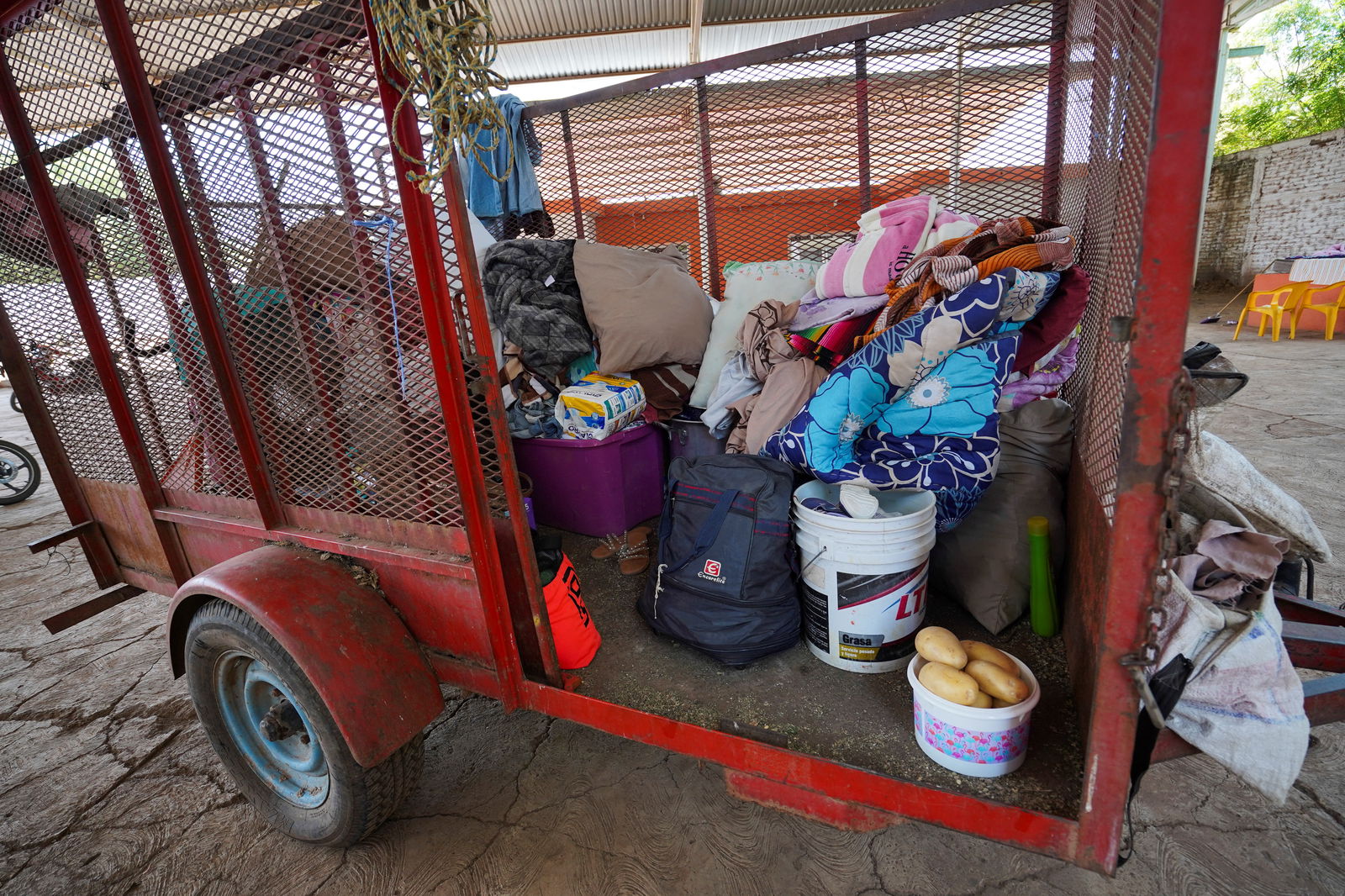 The belongings of a family fleeing organized crime violence in their town, are seen in a trailer at an improvised shelter, in Apatzingan, in Michoacan state, Mexico, July 3, 2023. 