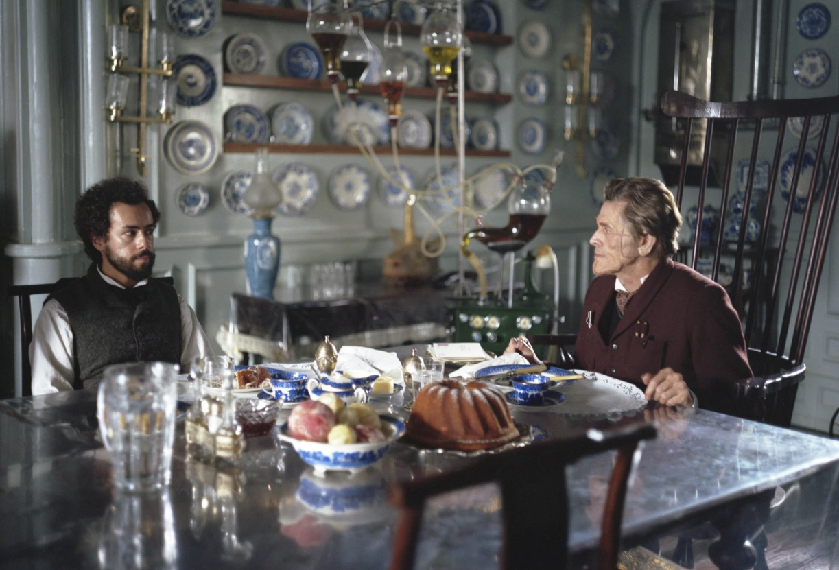 Ramy Youssef, left, and Willem Dafoe in a scene from “Poor Things.”