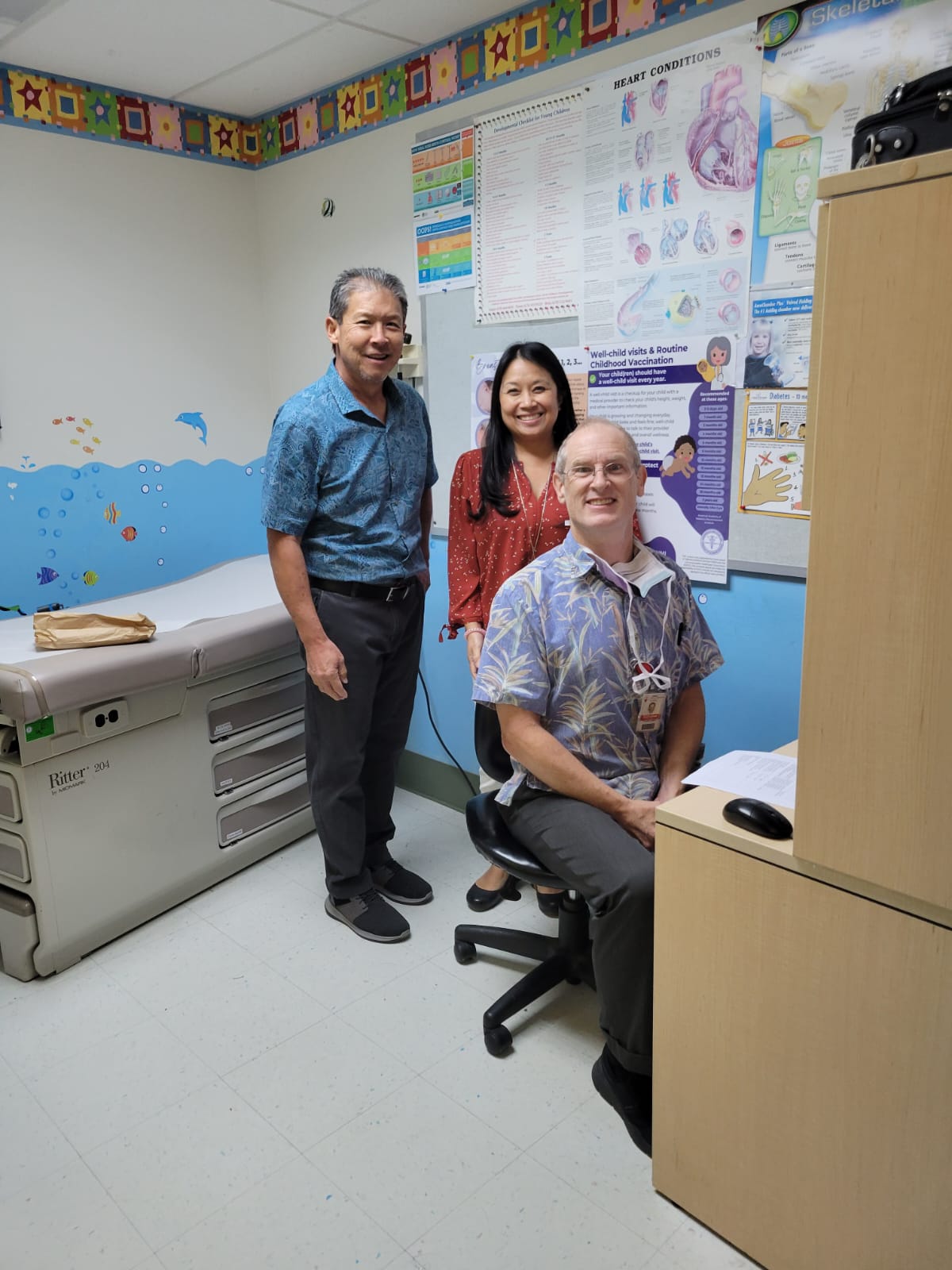 Rob Miyamoto, research specialist; Vena Joco, nurse practitioner; and Dr. Jonathan Pellett, pediatric orthopedic surgeon.