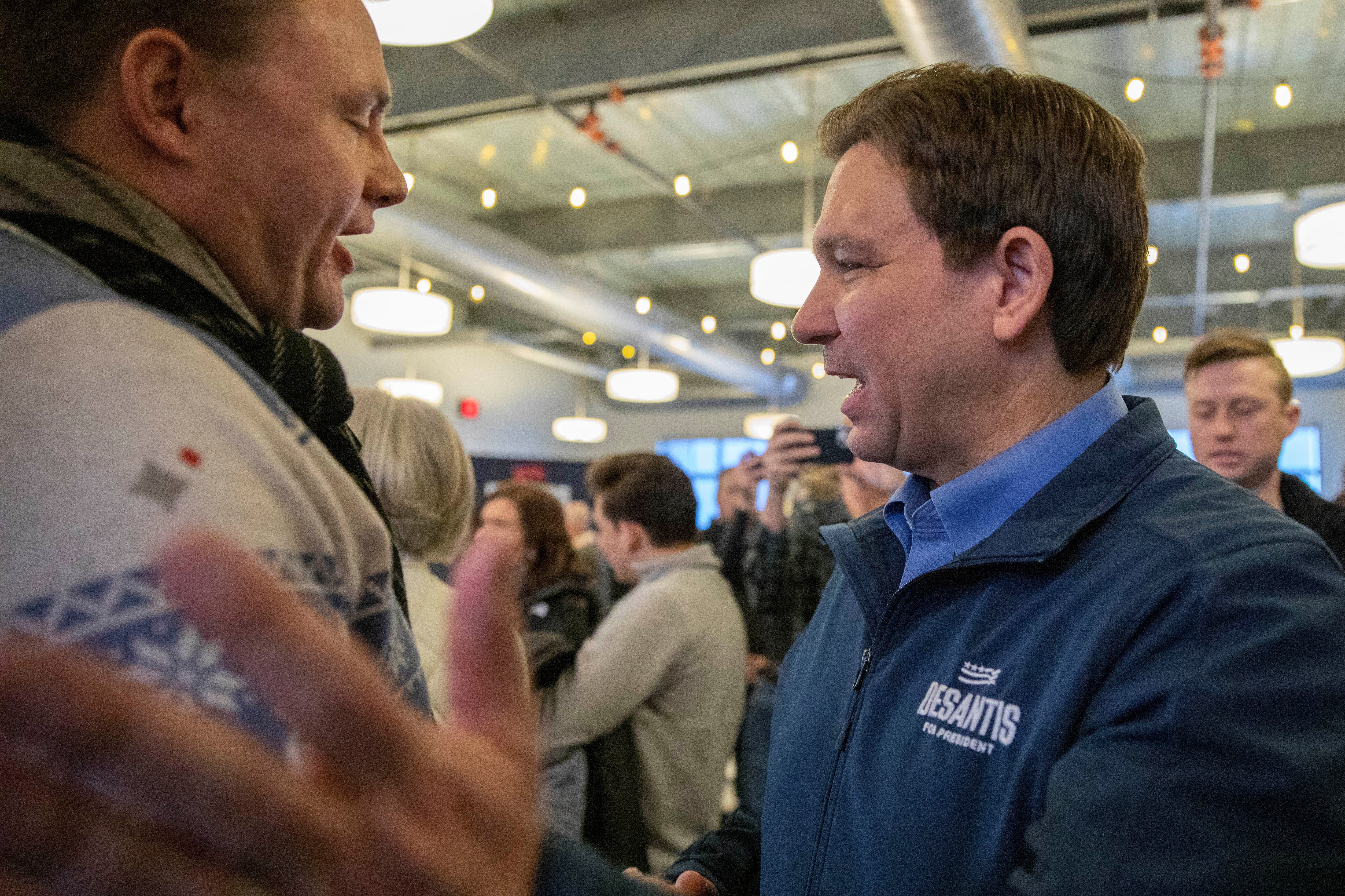Republican presidential candidate Florida Governor Ron DeSantis greets people following a campaign event at the Northside Conservatives Club Meeting in Ankeny, Iowa, U.S., January 12, 2024. 