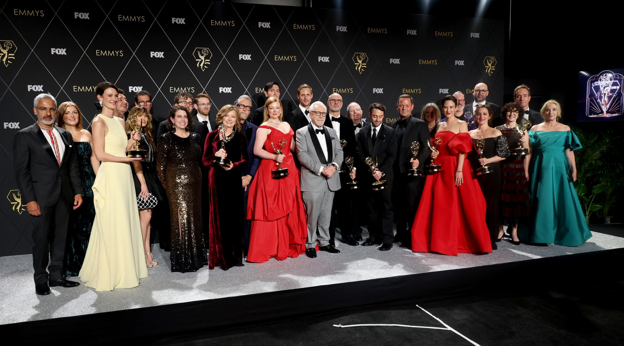 Kieran Culkin, Bryan Cox, Sarah Snook, Nicholas Braun, Alan Ruck and cast members from "Succesion" pose together with awards, at the 75th Primetime Emmy Awards in Los Angeles, California, Jan. 15, 2024.
