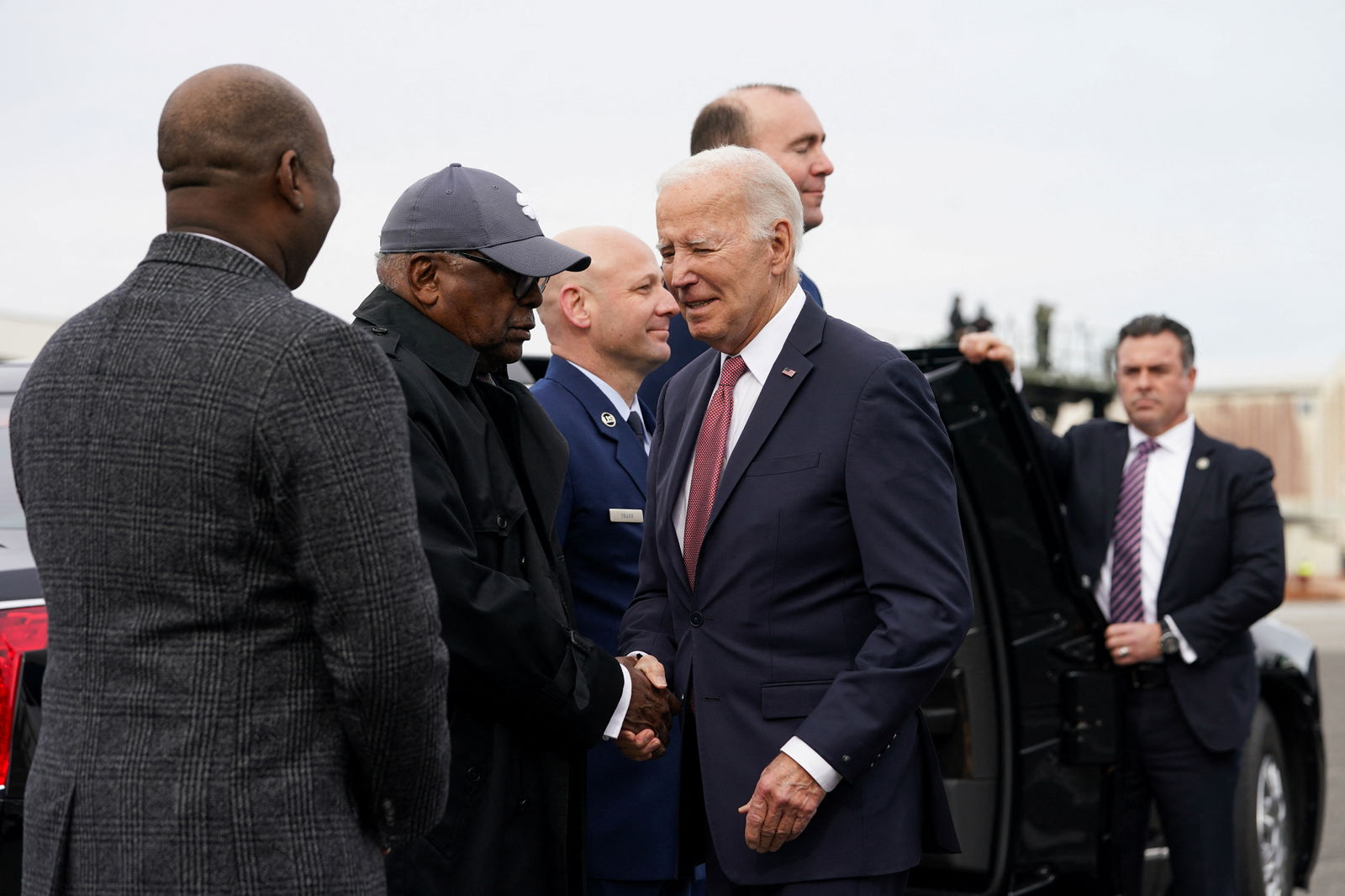 U.S. President Joe Biden shakes hands with U.S. Representative Jim Clyburn (D-SC) as he arrives in Charleston, South Carolina, U.S., January 8, 2024. 