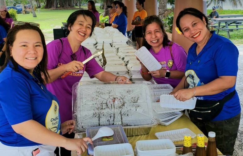 Team-building food committee members pose for a photo.
