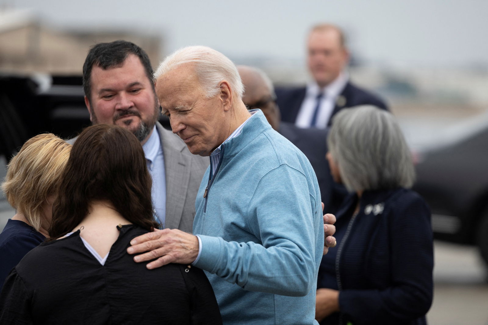 U.S. President Joe Biden greets Cate Miles, daughter of West Columbia Mayor Tem Miles, outside Air Force One at Columbia Metro Airport in West Columbia, South Carolina, U.S., January 27, 2024. 