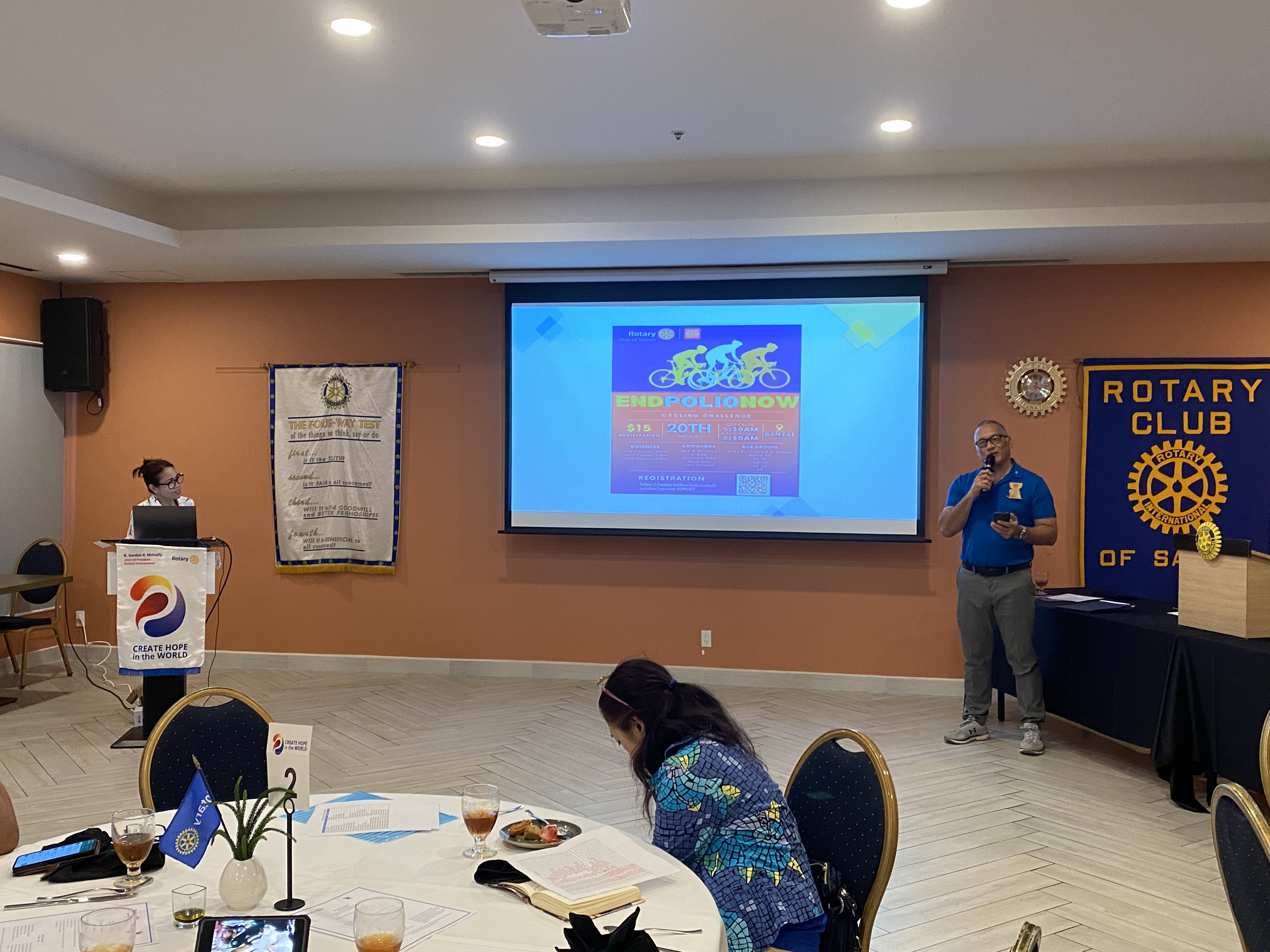 Rotary Club of Saipan President Irene Holl, left, listens to Rotarian Charles Cepeda during a meeting on Tuesday at Crowne Plaza Resort