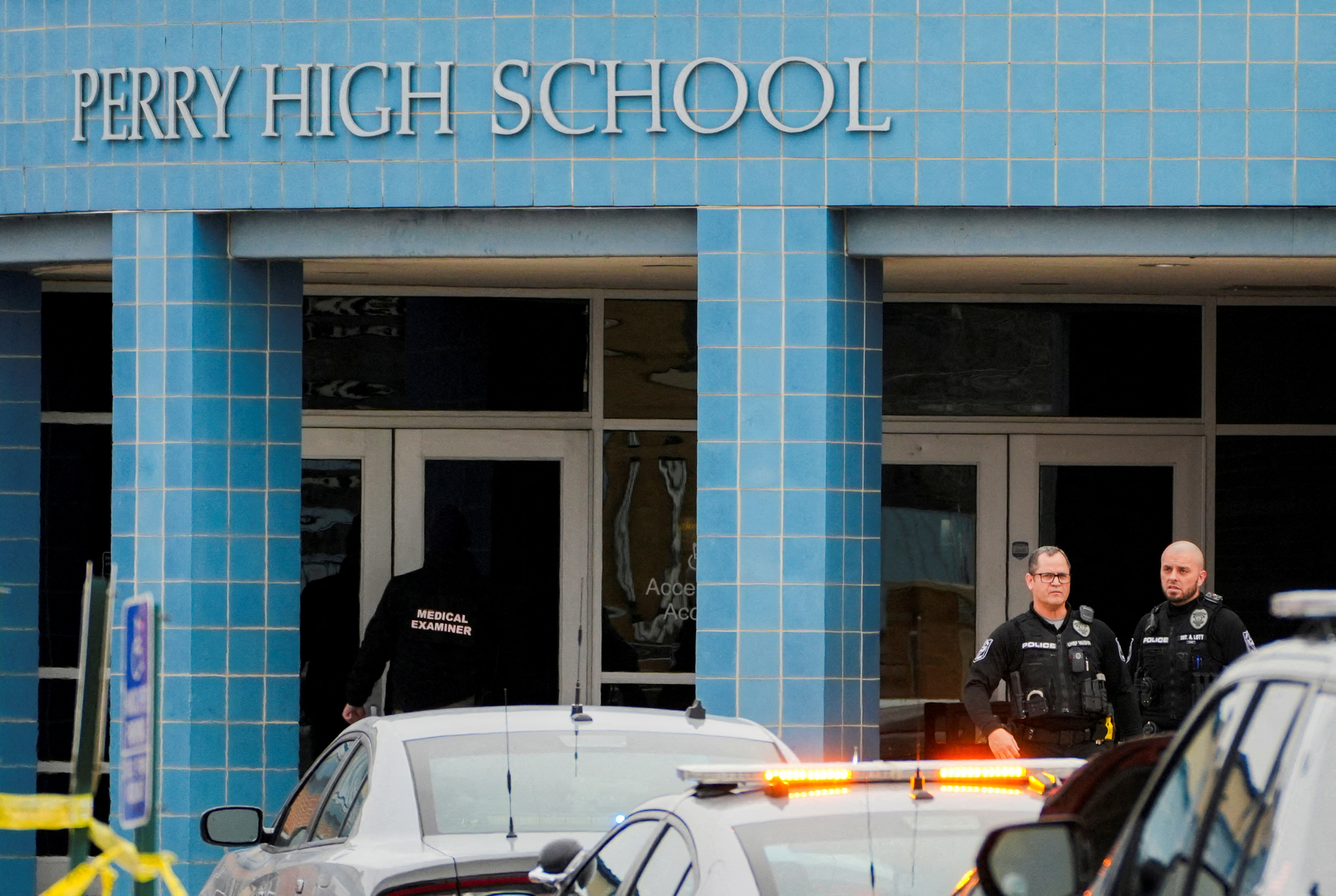 FILE PHOTO: A medical examiner enters the school as police respond to a school shooting at the Perry Middle School and High School complex in Perry, Iowa, U.S., January 4, 2024. REUTERS/Cheney Orr/File Photo