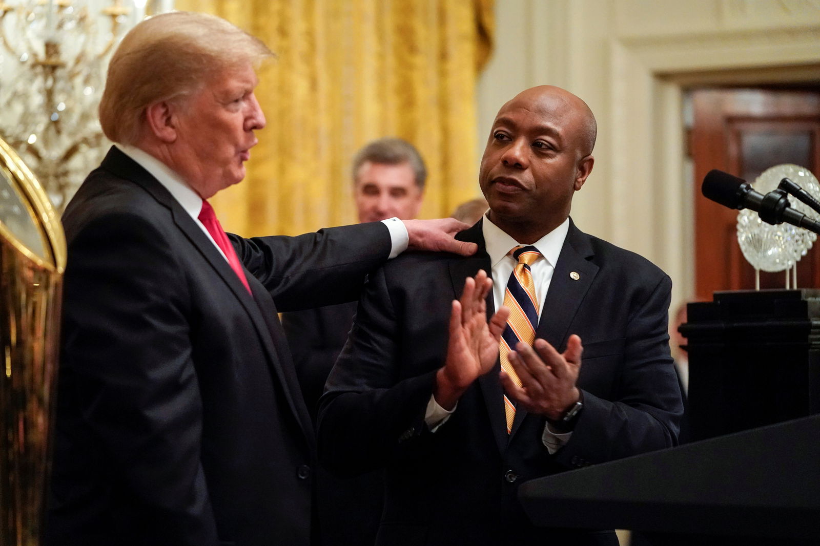 U.S. President Donald Trump greets Senator Tim Scott (R-SC) as he welcomes the 2018 College Football Playoff National Champion Clemson Tigers at the White House in Washington, U.S., January 14, 2019. 