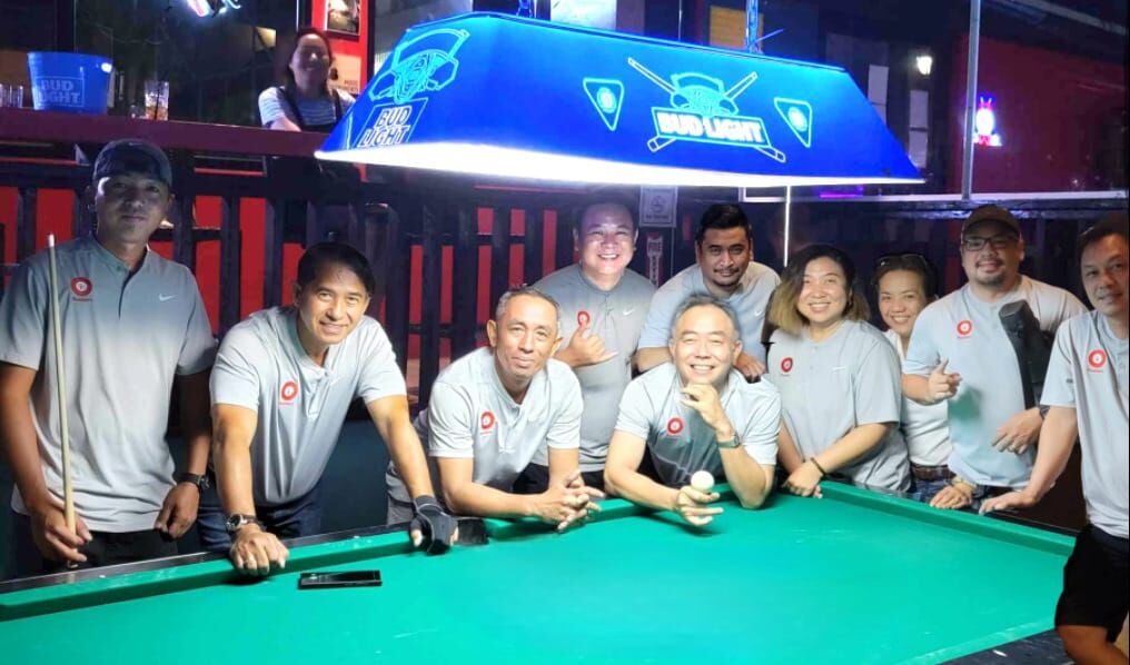 The Black 8 Ideal Signs Rustlers pose for a photo after winning the Tuesday division championship of the 2023 SBA Budweiser Open 8-Ball League at the Black 8 Pool Bar. 