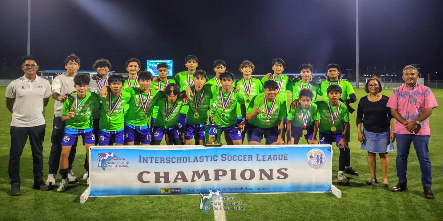 Marianas High School players pose with the boys high school division championship trophy  of the NMIFA-PSS Interscholastic Soccer League SY23-24 at the NMI Soccer Training Center in Koblerville on Thursday.