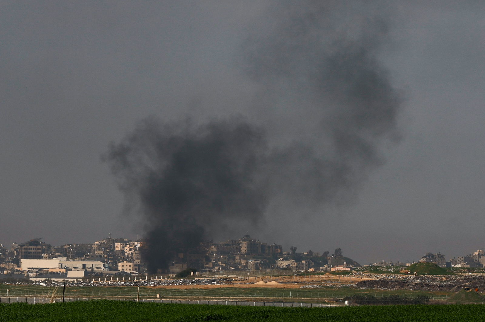 Smoke rises from Gaza, amid the ongoing conflict between Israel and the Palestinian Islamist group Hamas, as seen from southern Israel, January 21, 2024. 