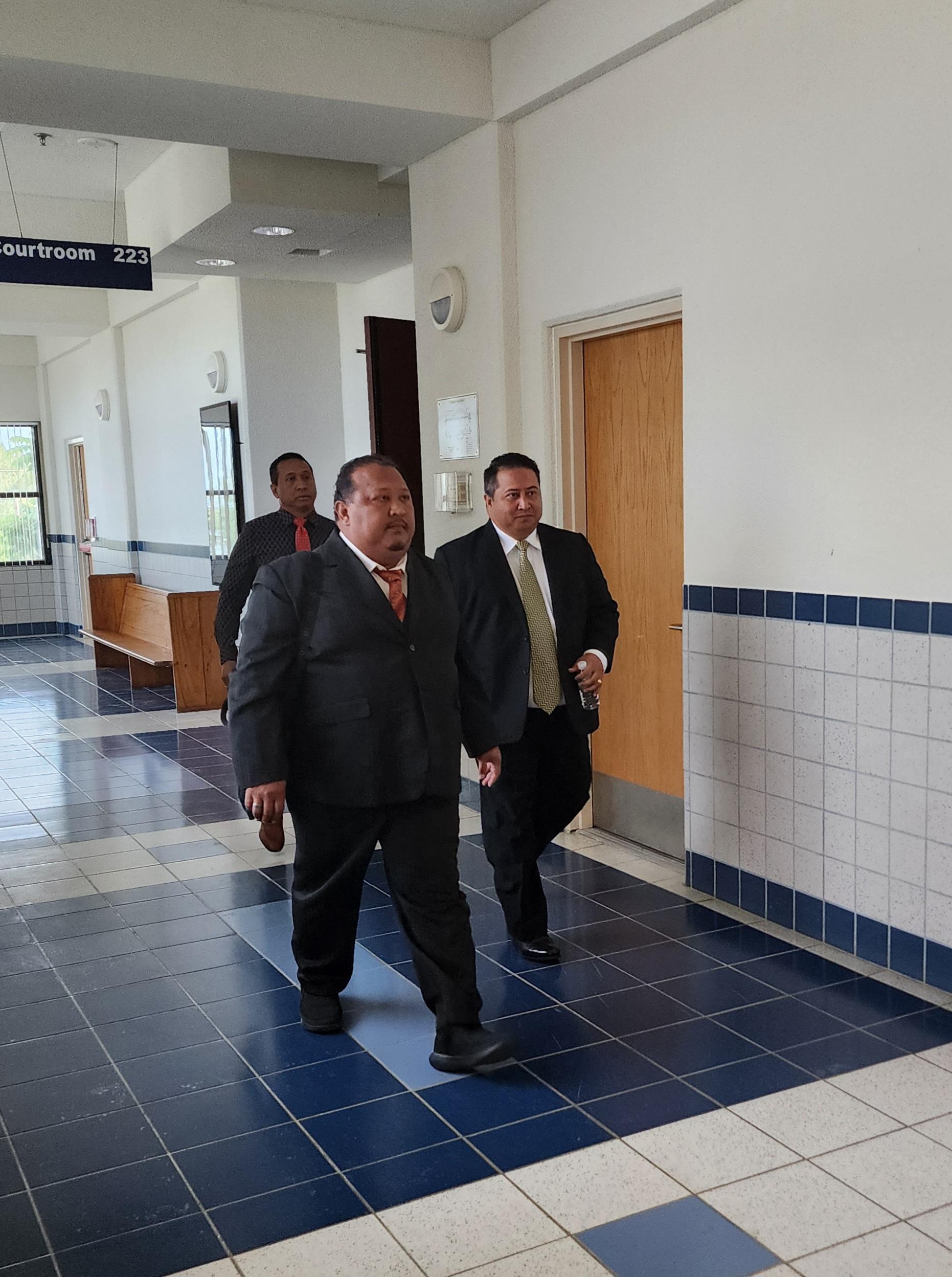 Former Gov. Ralph DLG Torres, right, with his brothers, attorneys Joaquin and Vincent Torres, at the local courthouse on Monday.
