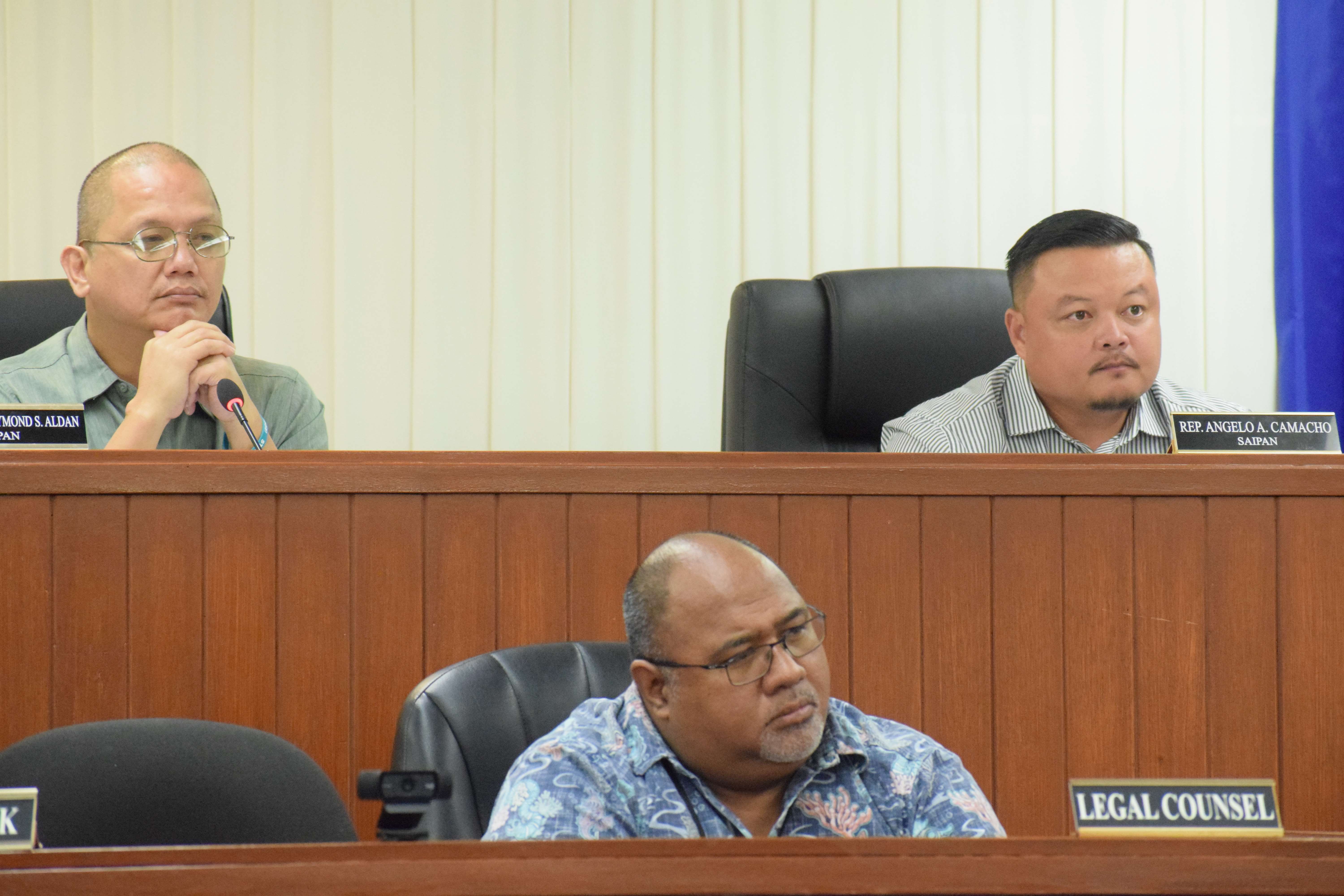The chairman of the House Committee on Public Utilities, Transportation and Communications, Rep. Vincent S. Aldan, left, the vice chairman, Rep. Angelo Camacho right, and House legal counsel Joe Taijeron listen to the remarks of Rep. Marissa Flores — not in photo — during a meeting in the House chamber on Tuesday.
