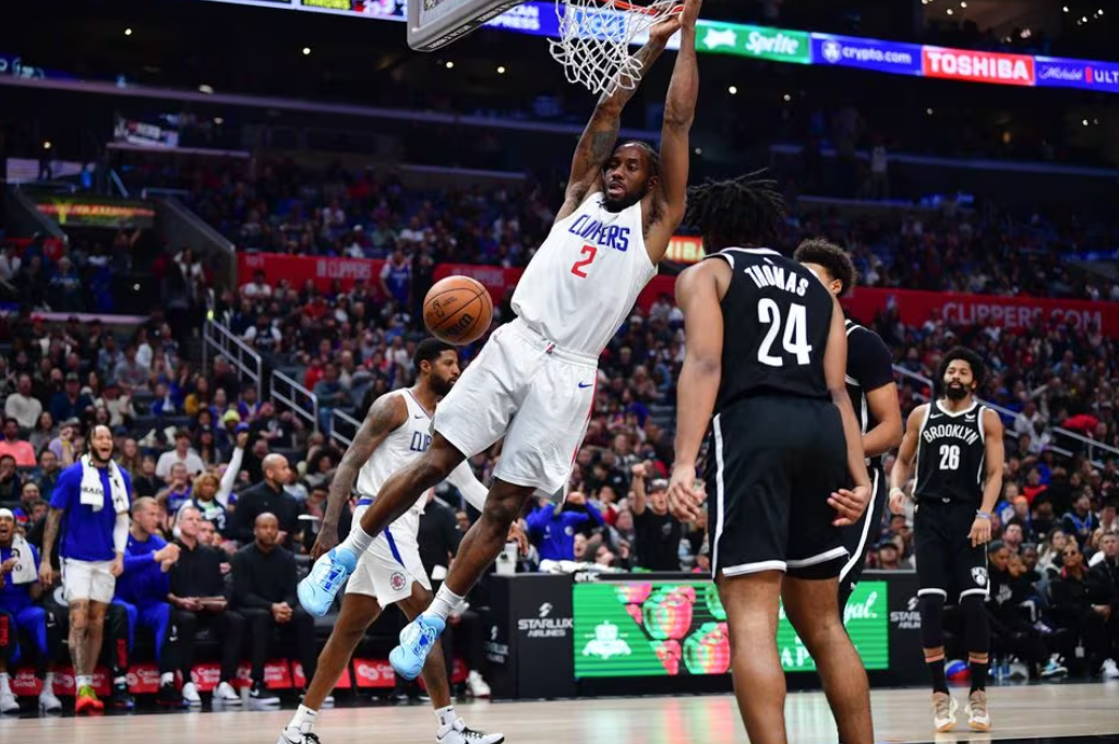 Los Angeles Clippers forward Kawhi Leonard (2) dunks for the basket against the Brooklyn Nets during the second half at Crypto.com Arena in Los Angeles, California,  Jan. 21, 2024.