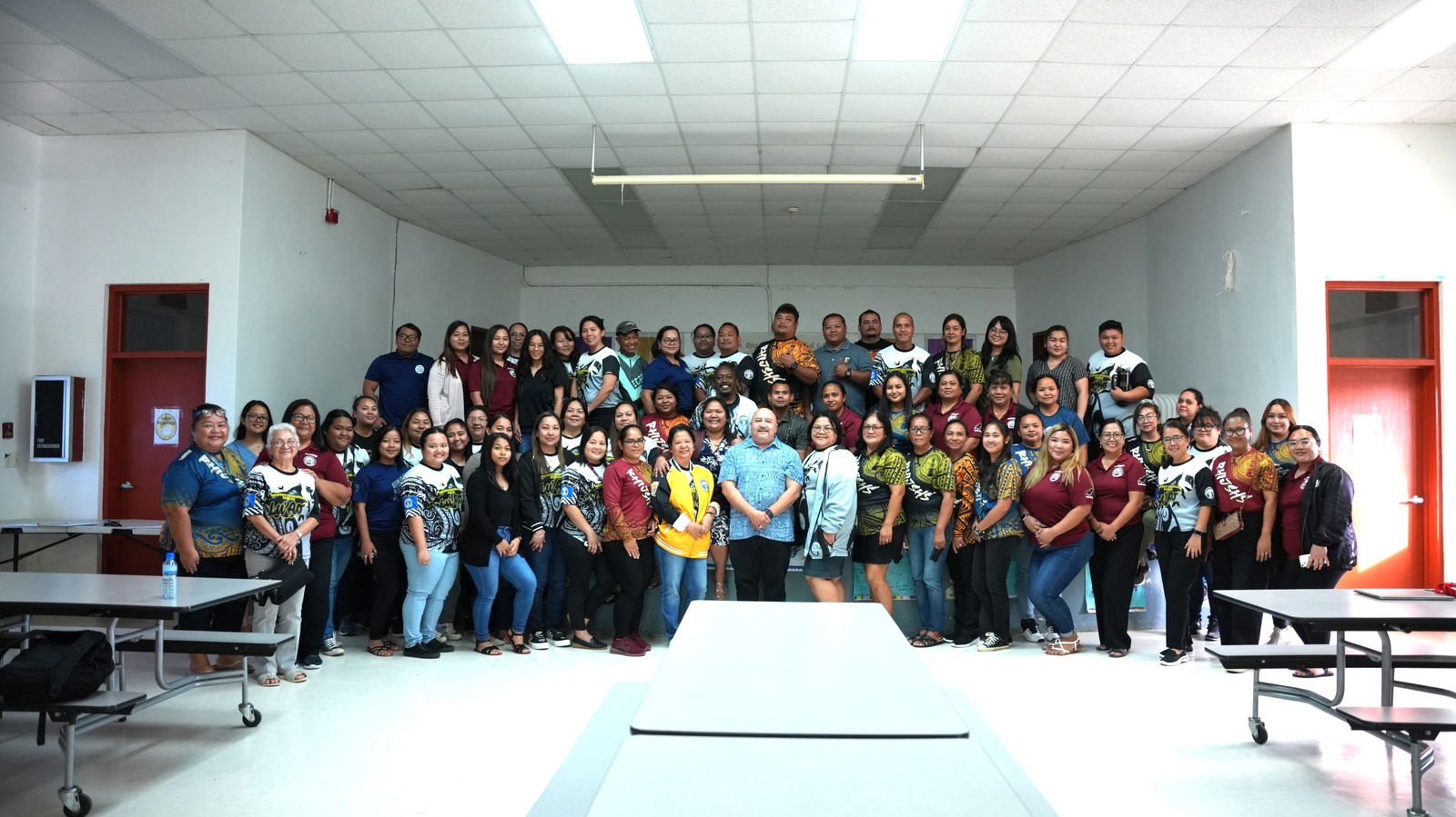Dr. Rita H. Inos Junior-Senior High School and Sinapalo Elementary School staff and personnel pose for a photo with Commissioner of Education Dr. Lawrence Camacho.