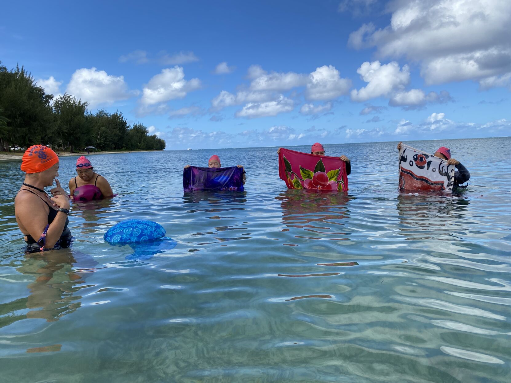 In this Feb. 2023 file photo, Andrea Carr of 500 Sails shows how a lavalava can be turned into an improvised flotation device in the event of an emergency situation.