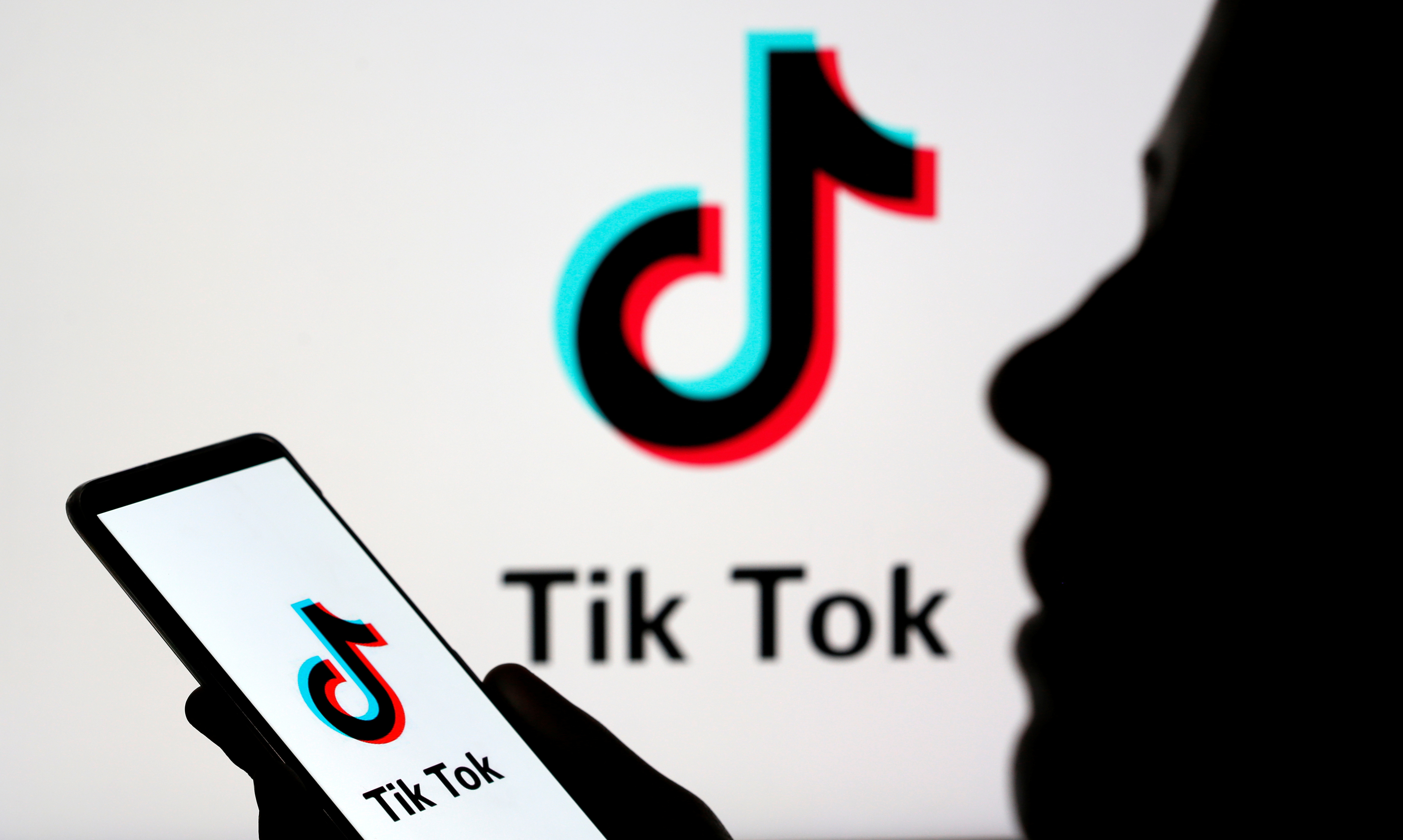 A person holds a smartphone with Tik Tok logo displayed in this picture illustration taken November 7, 2019. Picture taken November 7, 2019. 