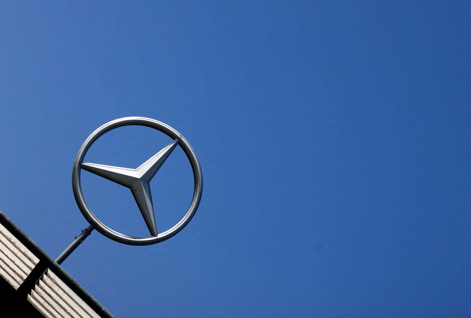 The logo of Mercedes-Benz is seen outside a Mercedes-Benz car dealer in Brussels, Belgium June 1, 2023. 