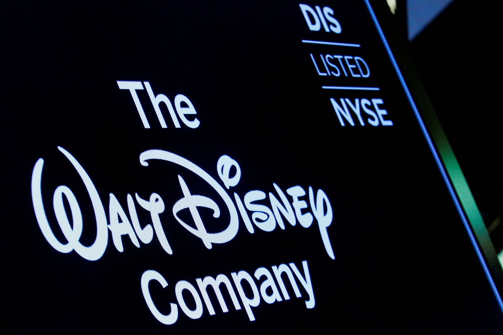 A screen shows the logo and a ticker symbol for The Walt Disney Company on the floor of the New York Stock Exchange (NYSE) in New York, U.S., December 14, 2017. 