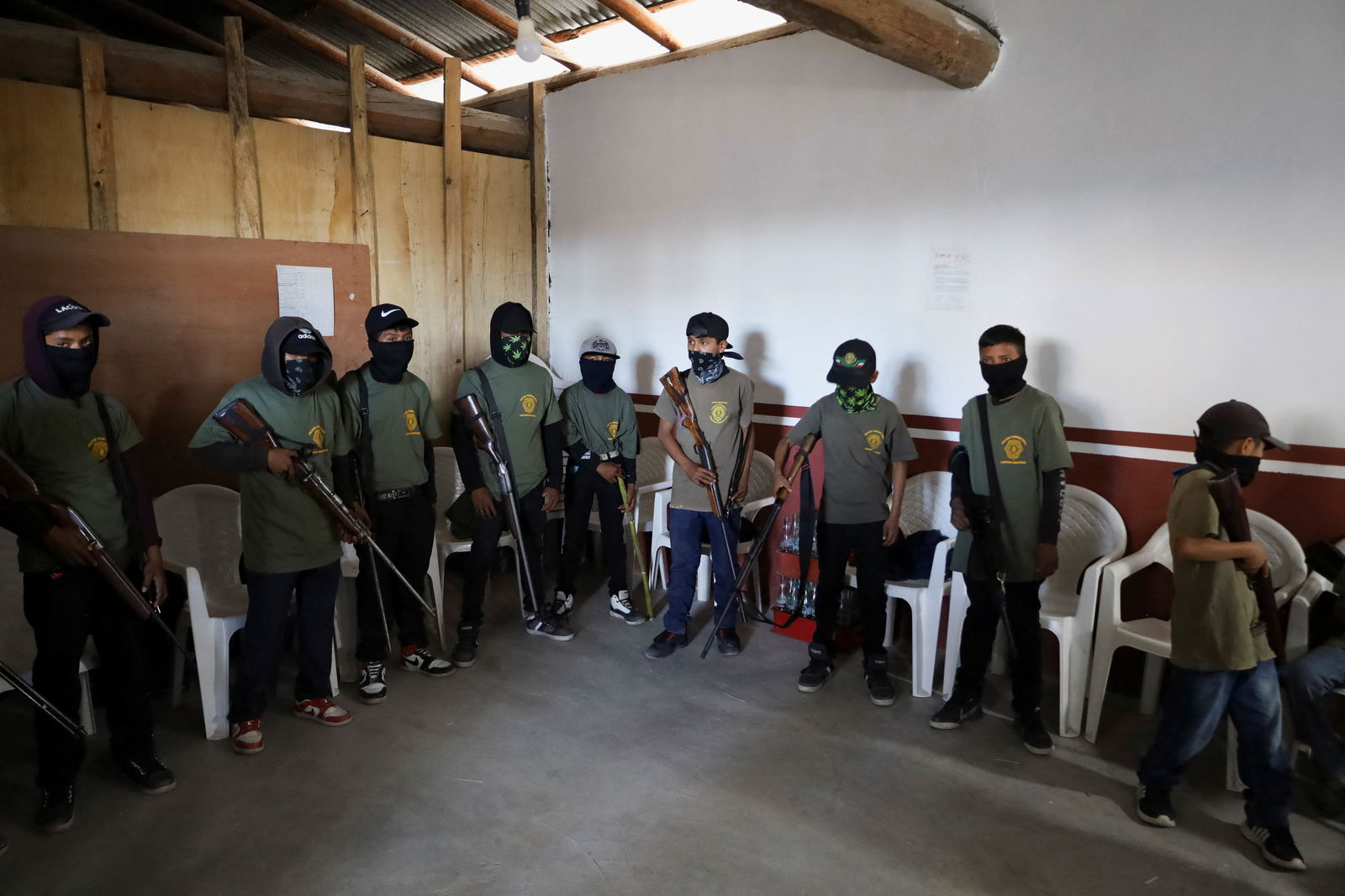 Children hold rifles before a ceremony to join the ranks of the community police, few days after an armed group abducted four people from the community, in Ayahualtempa, Guerrero state, Mexico, January 24, 2024. 