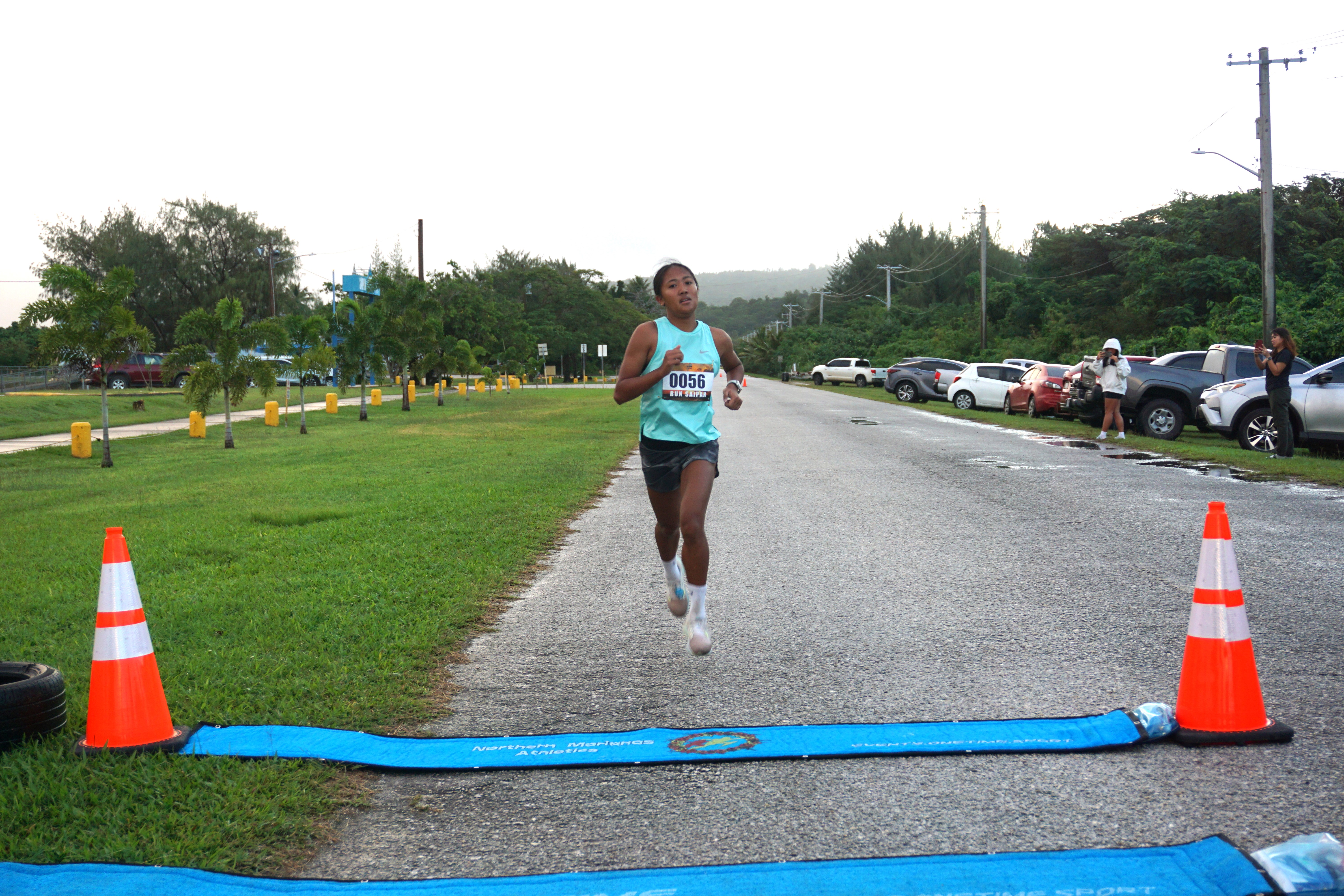 Kaithlyn Chavez heads to the finish line of Run Saipan's Run from 2023 1-mile race on Sunday morning at Smiling Cove Marina.