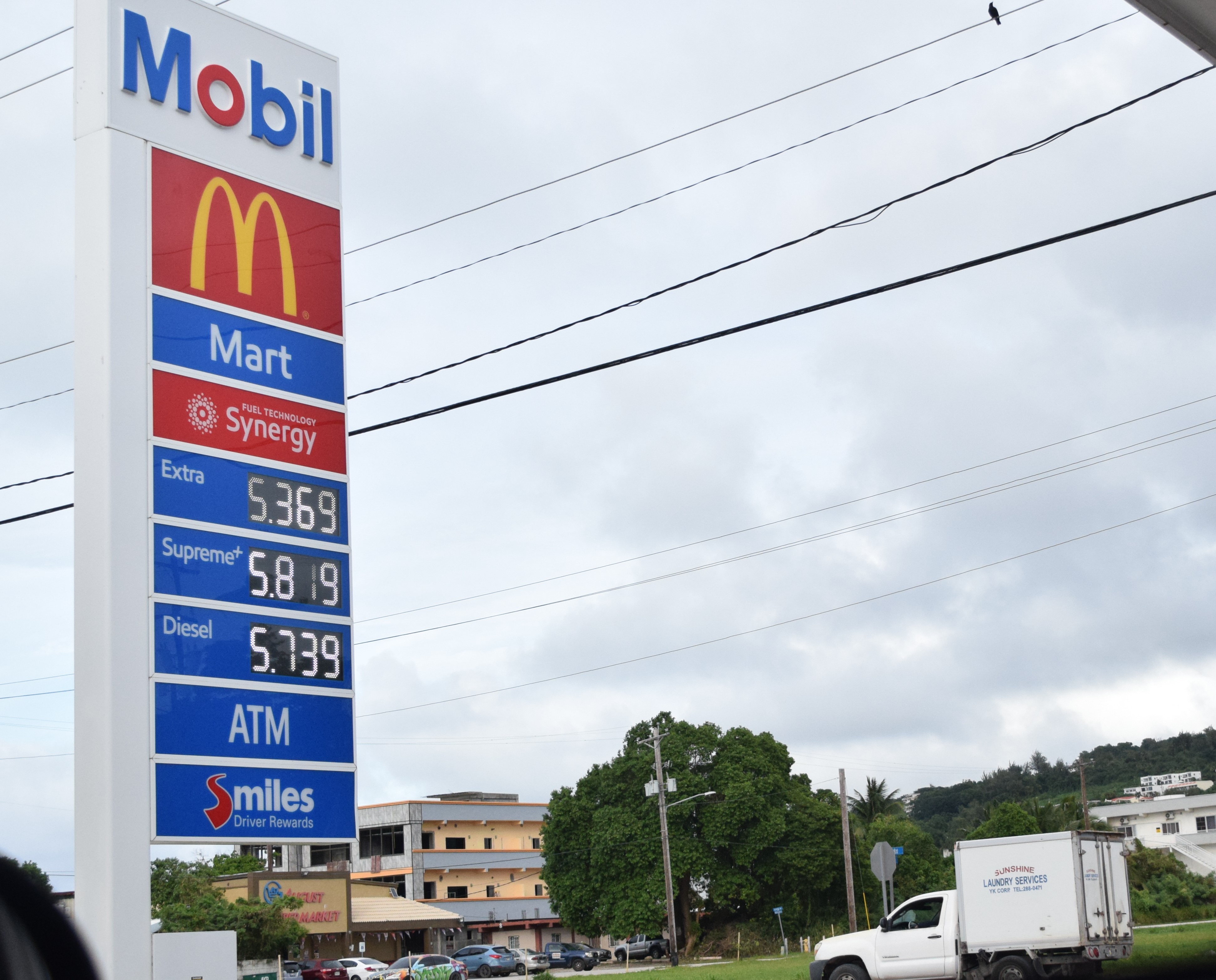 The Mobil Oil gas station on Beach Road in Garapan displays its new fuel prices on Thursday.