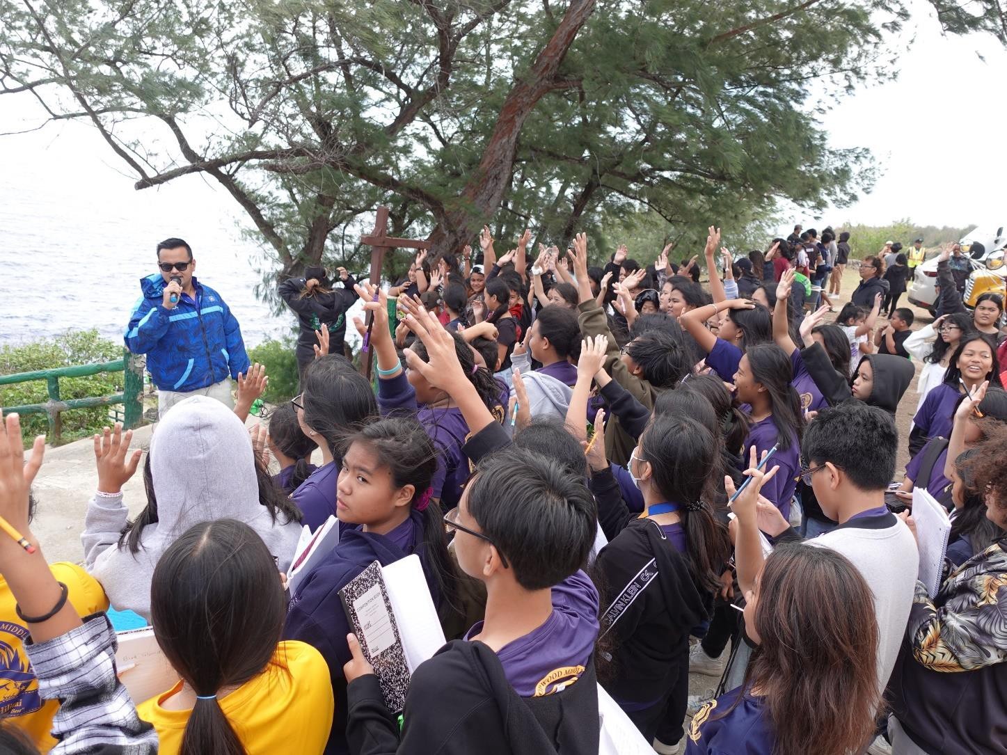 Run Saipan President Edward Dela Cruz, Jr. engages MY WAVE Club students at Bird Island Lookout in Marpi during the Marianas Tourism Education Council Tourism Summit on Jan. 19, 2024.