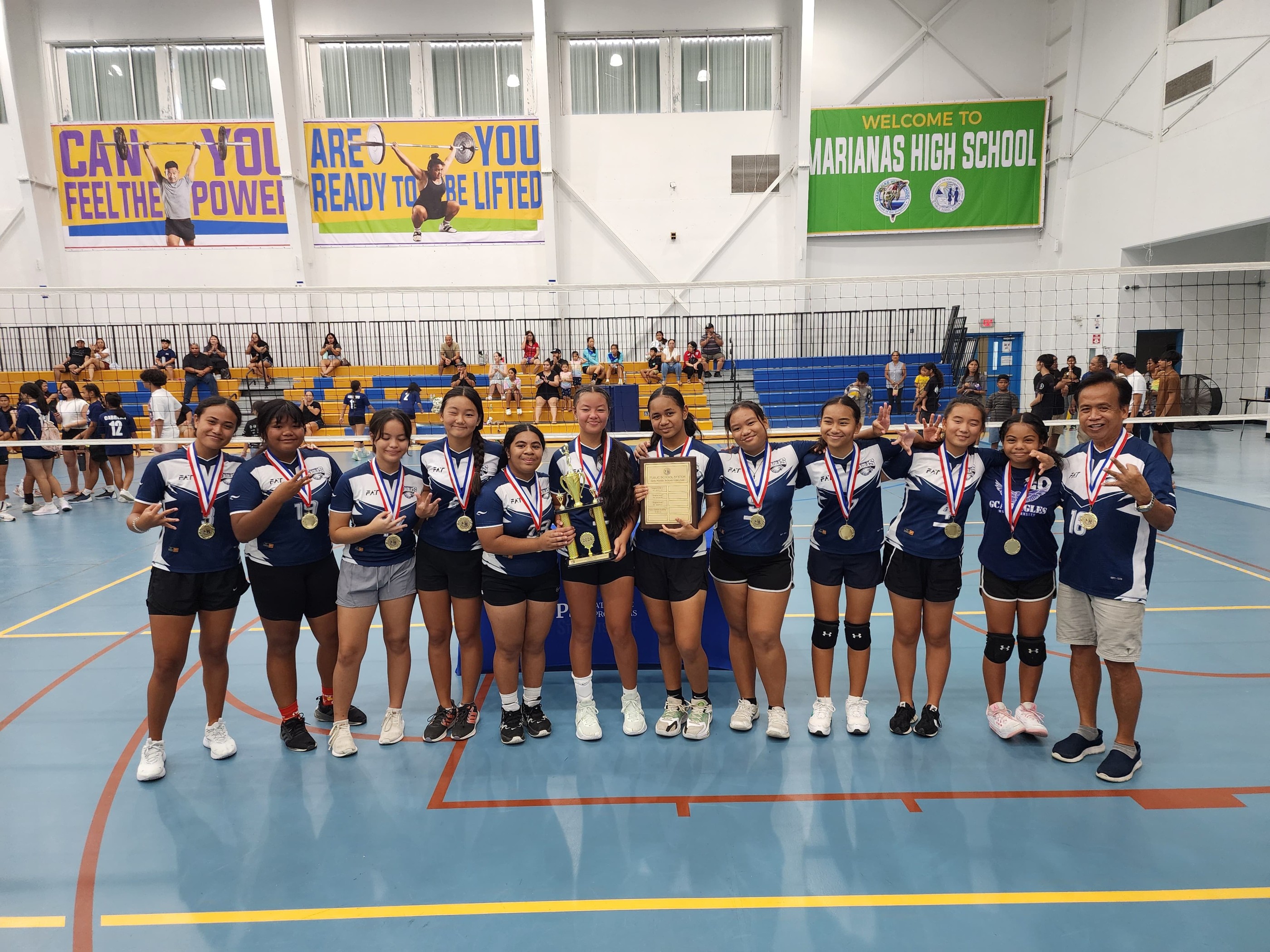 Grace Christian Academy players pose for a photo after successfully defending their volleyball title for the third straight year.
