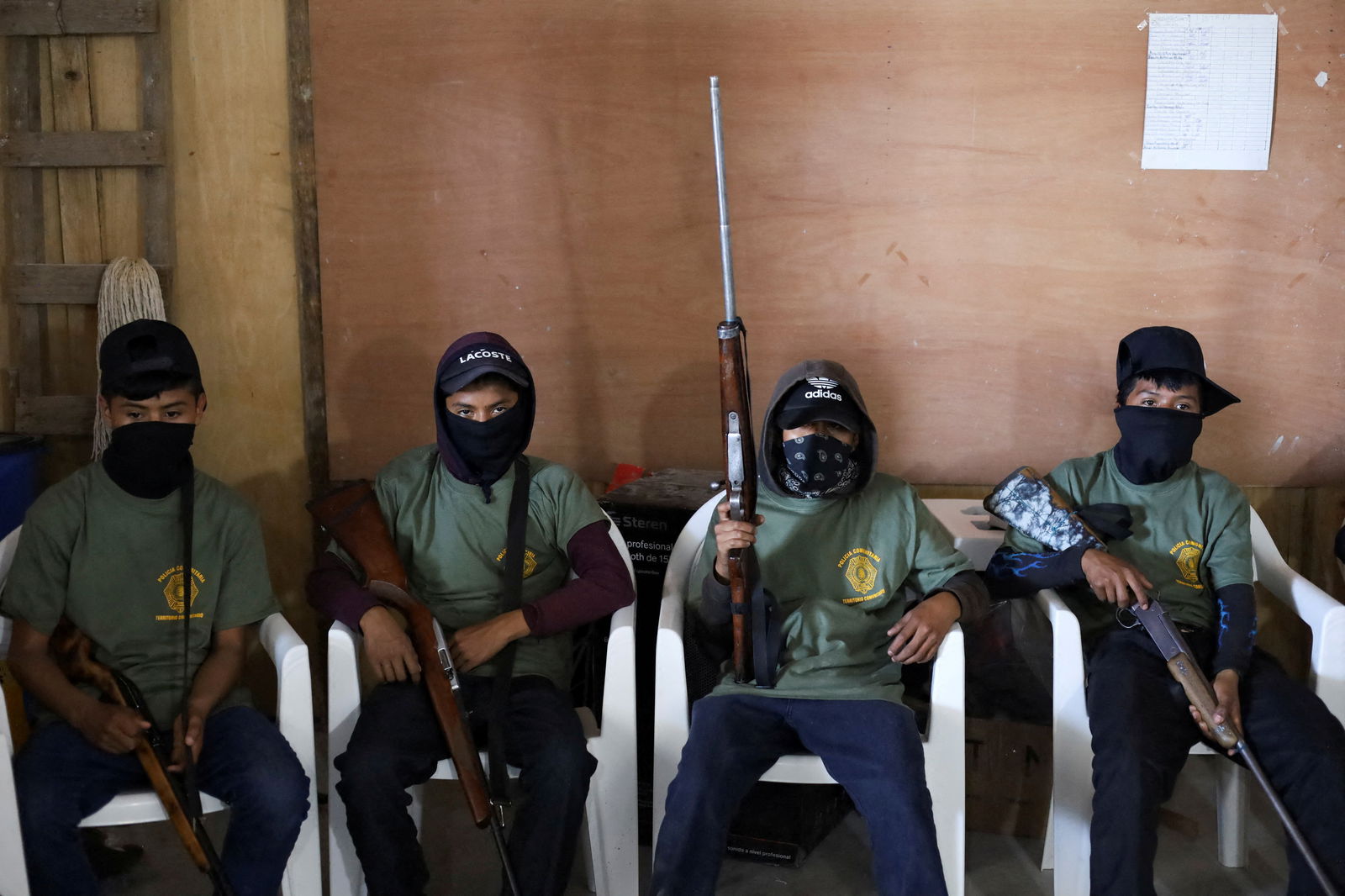 Children hold rifles before a ceremony to join the ranks of the community police, few days after an armed group abducted four people from the community, in Ayahualtempa, Guerrero state, Mexico, January 24, 2024. 