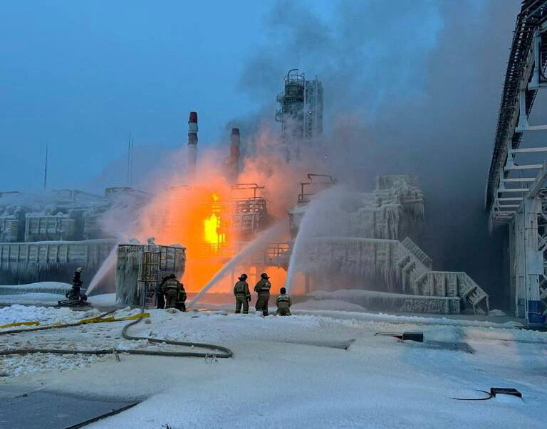 Firefighters work to extinguish fire at the Novatek terminal in the port of Ust-Luga, Russia, January 21, 2024. 