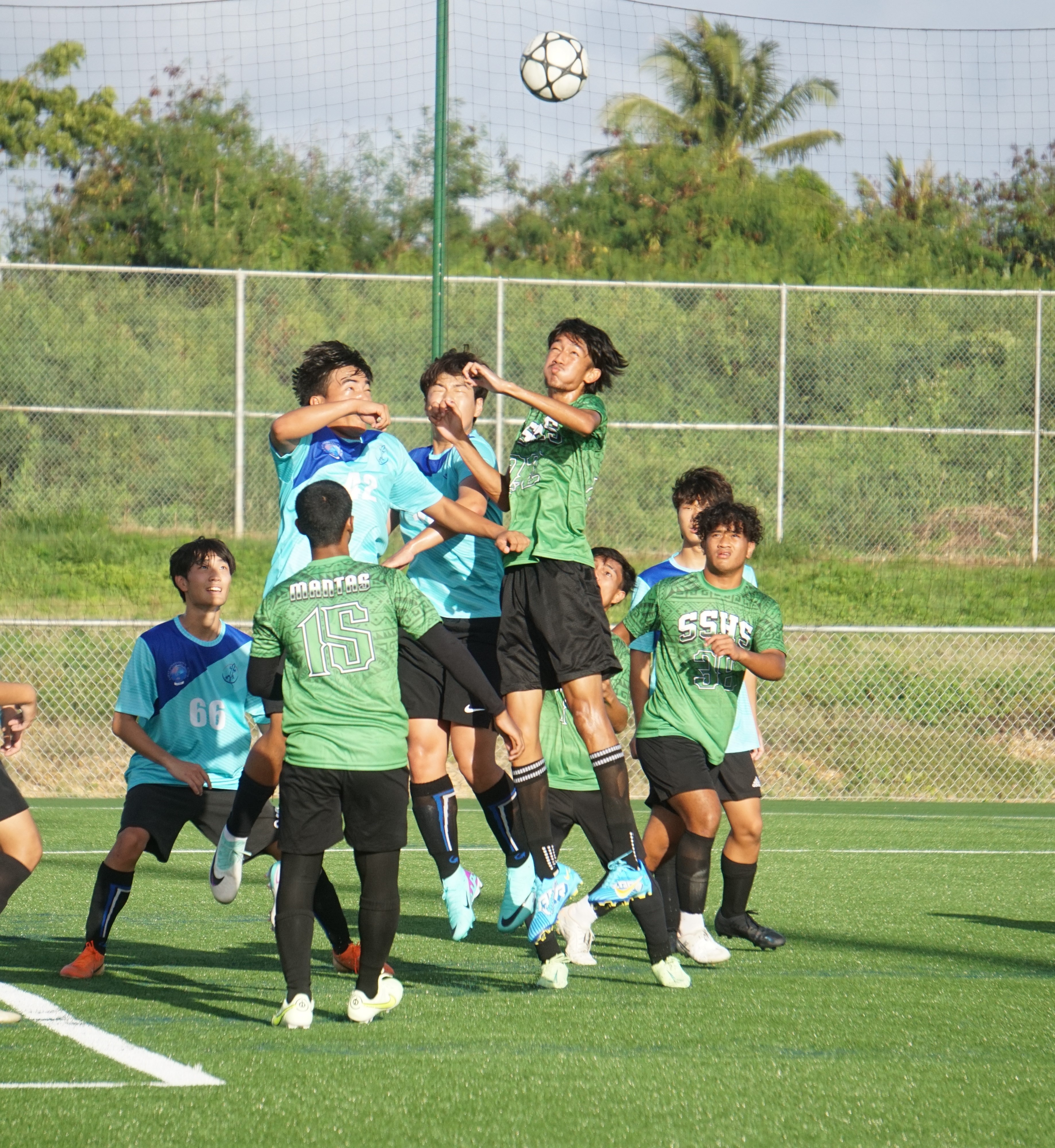 SSHS' Simon Tang and two SIS players leap for a header in an attempt to control the possession during a boys high school division semifinal match of the NMIFA-PSS Interscholastic Soccer League SY23-24 at the NMI Soccer Training Center in Koblerville on Tuesday.
