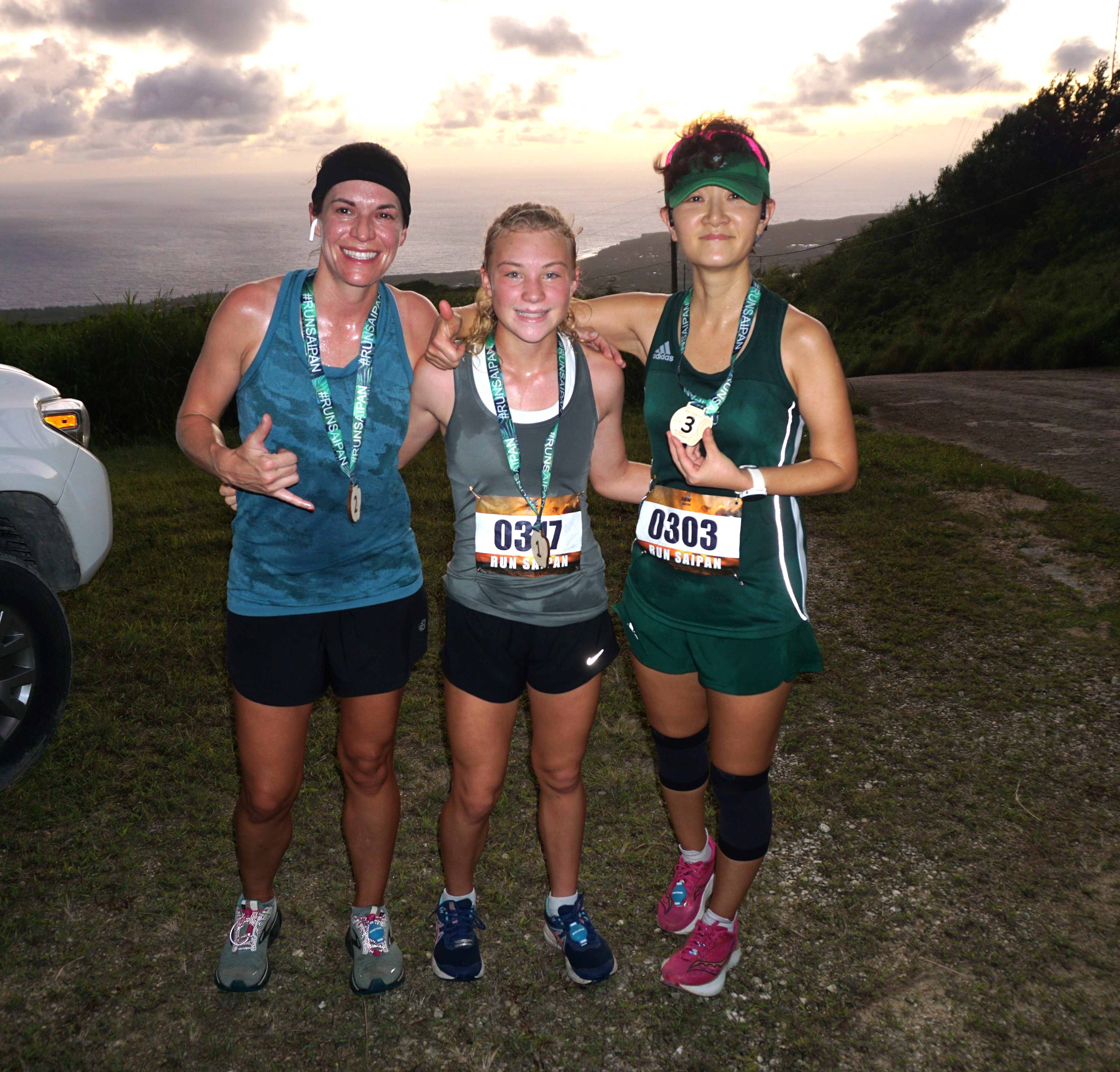 Addalee Taflinger, center, Shawna Brennfleck, left, and Ann Bang pose for a photo as the top three female racers of the Mt. Tapochao 5K segment of the 2nd Annual Run Saipan Trinity on Sunday morning.