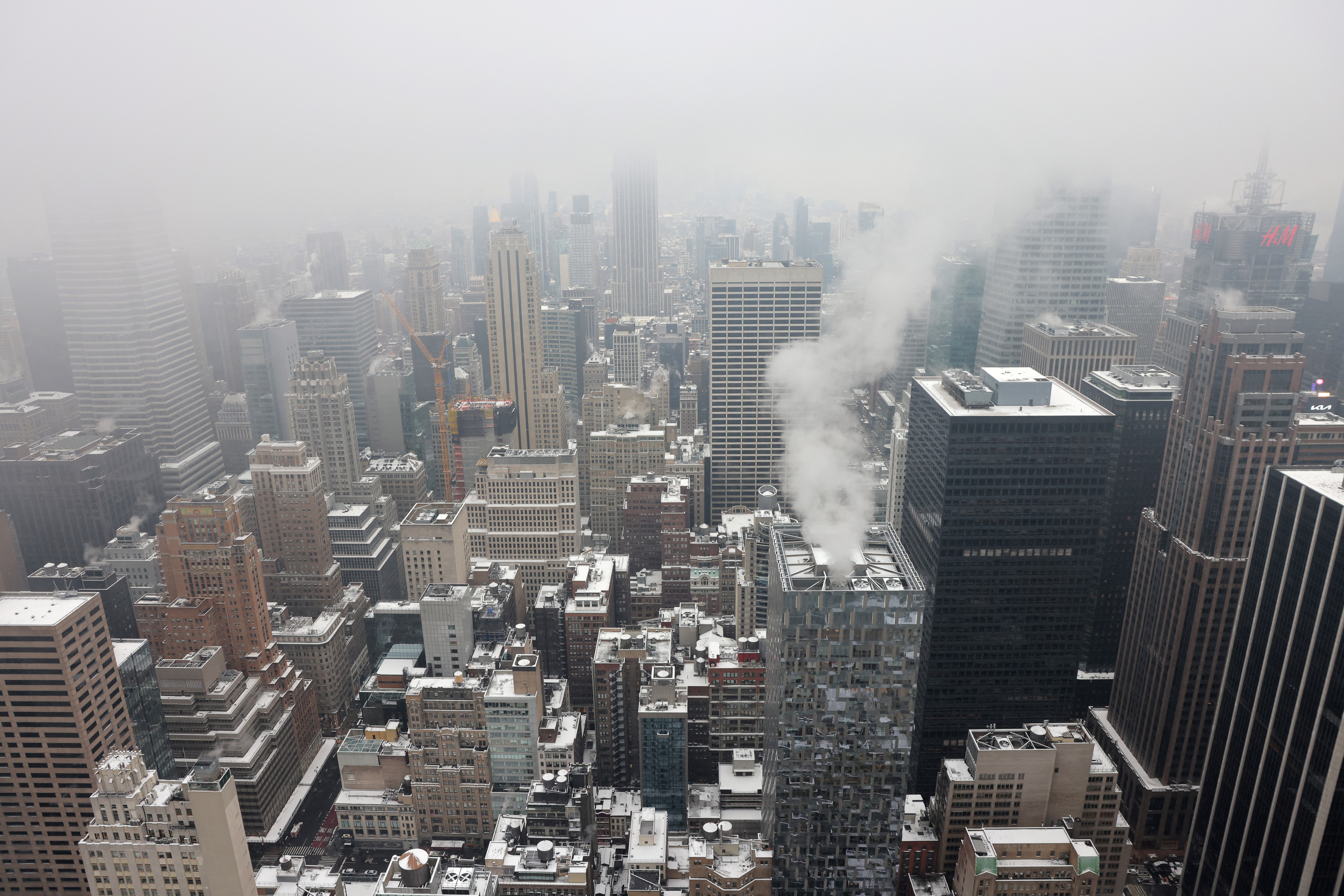 Snow sits on rooftops during the first snowfall in over 700 days in Manhattan, New York City, U.S., January 16, 2024. 
