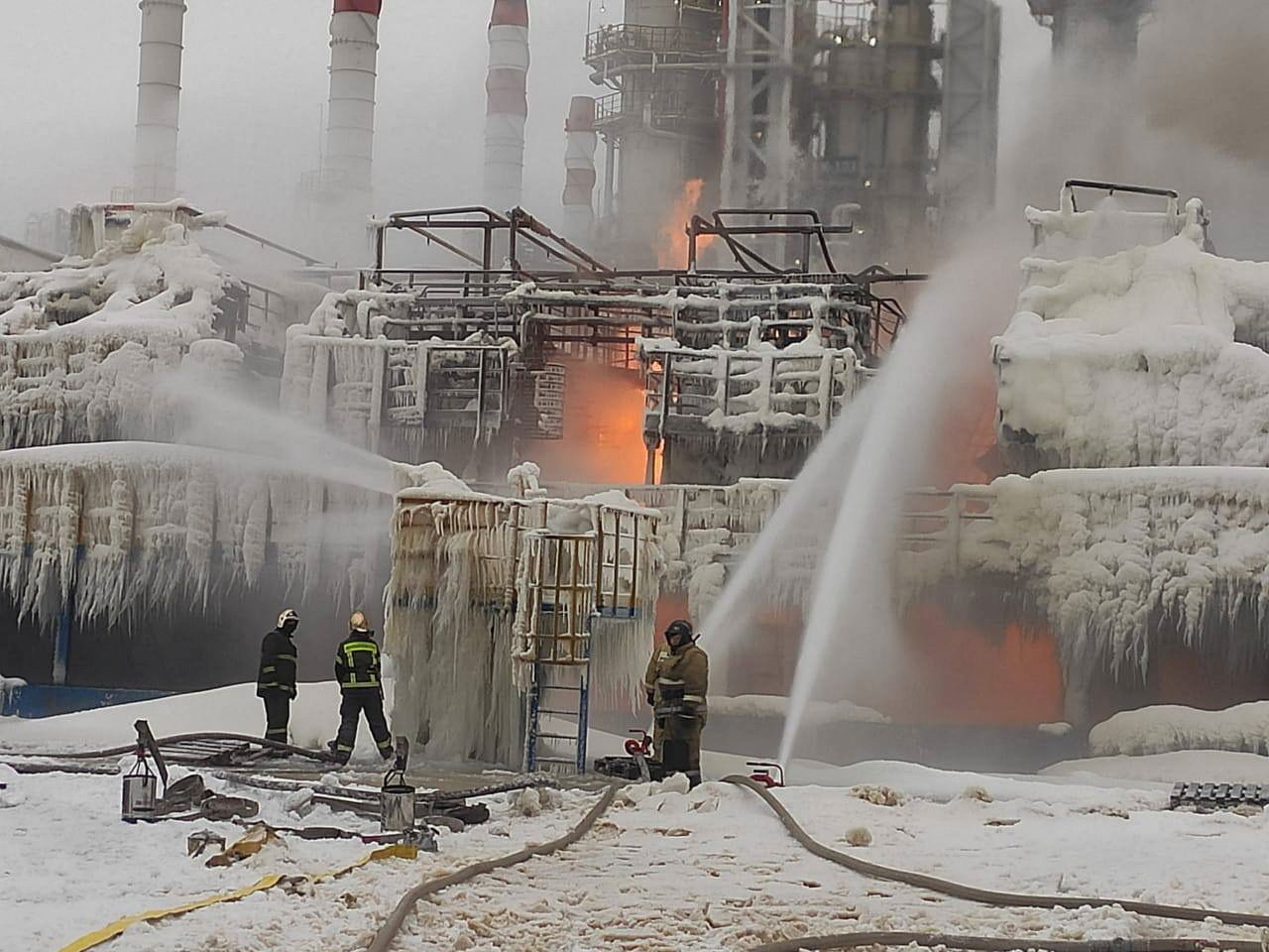 Firefighters work to extinguish fire at a terminal belonging to Novatek, Russia's largest liquefied natural gas producer, in the port of Ust-Luga, Russia, January 21, 2024. 