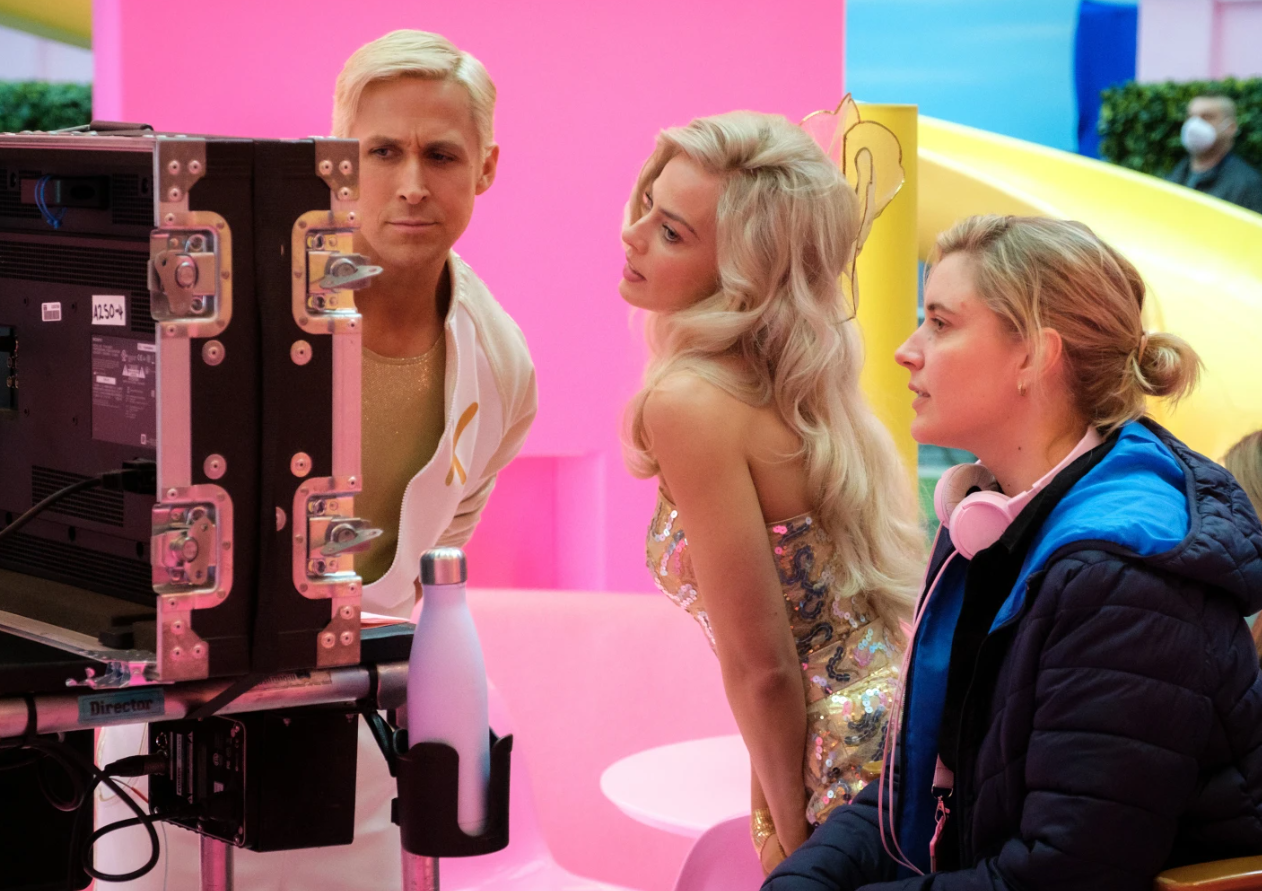 Ryan Gosling, left, Margot Robbie, center, with Greta Gerwig on the set of “Barbie.”