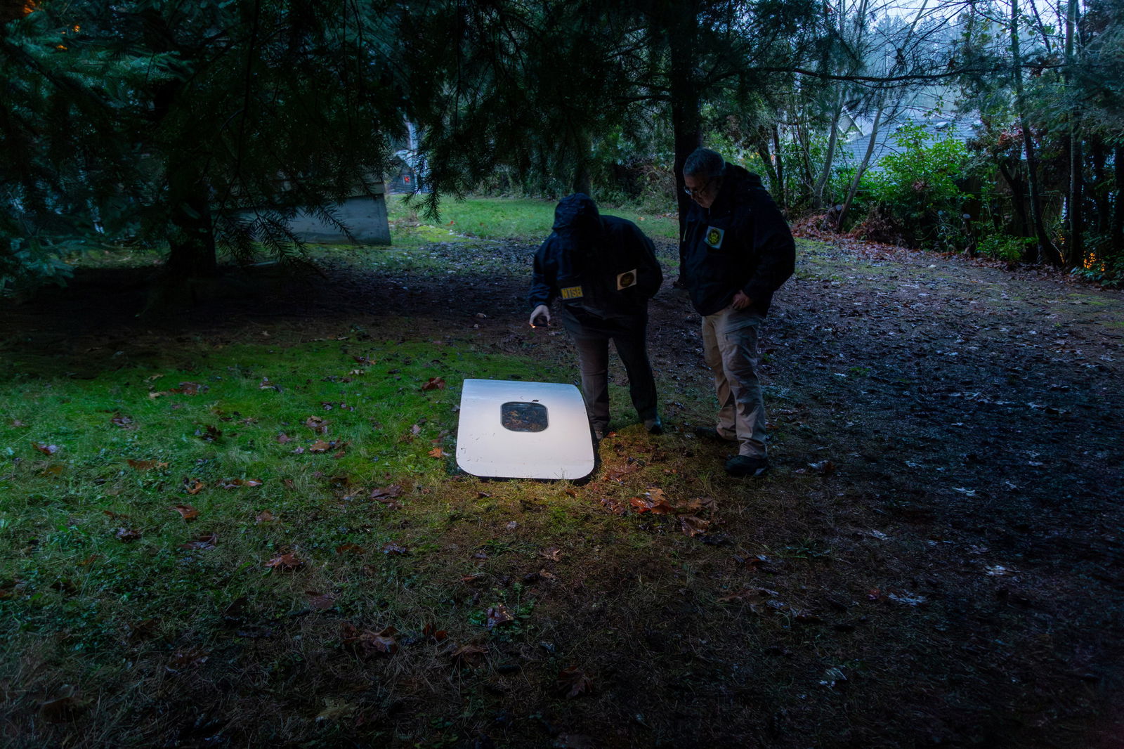 National Transportation Safety Board (NTSB) investigators examine the fuselage plug area of Alaska Airlines Flight 1282 Boeing 737-9 MAX, which was jettisoned and forced the aircraft to make an emergency landing, at a property where it was recovered in Portland, Oregon, U.S. January 8, 2024. 