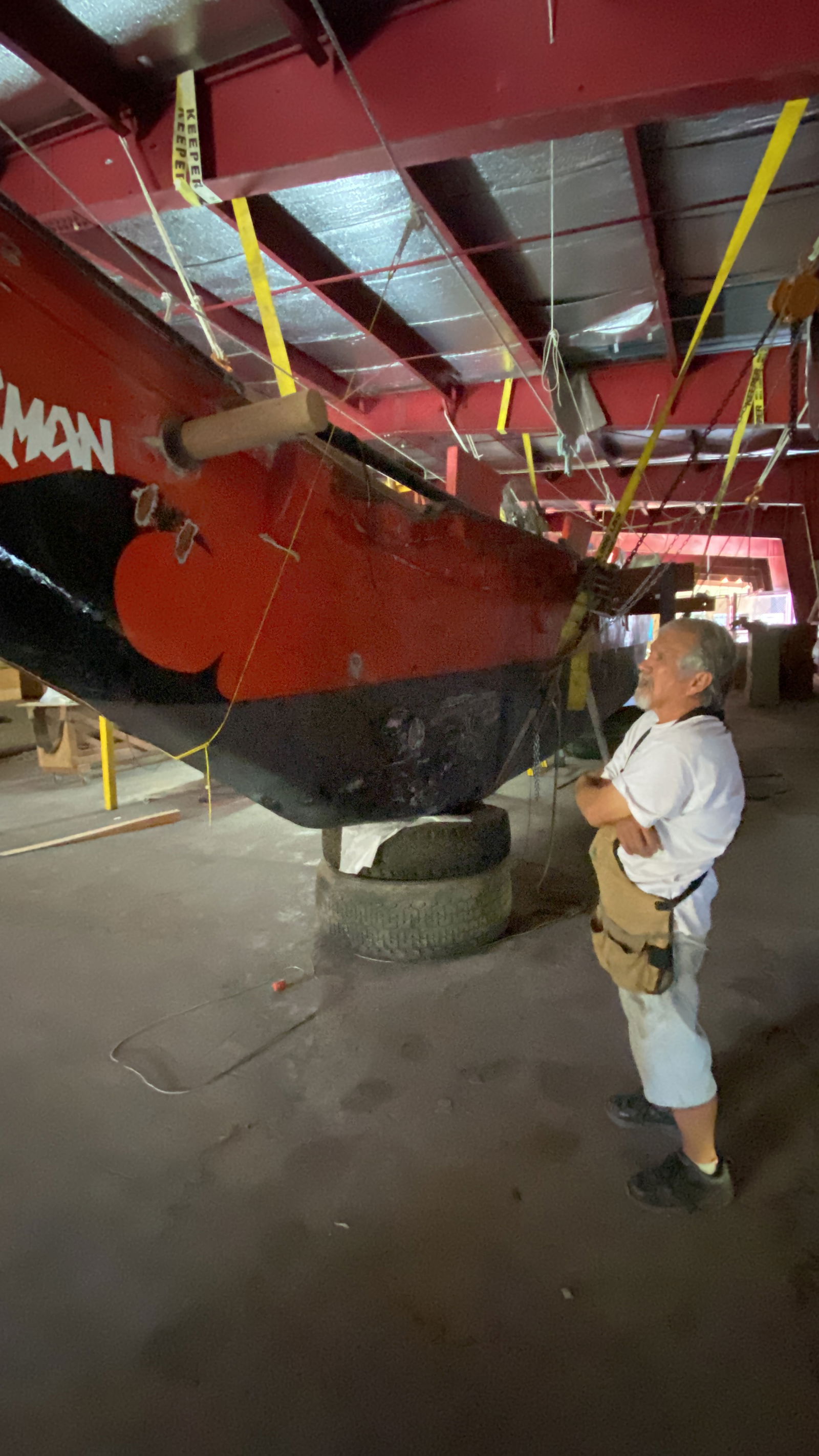 Mario Borja believes Che'lu could be ready for the waters right off of Saipan as early as February. Most of Che'lu's maintainance has not been extensive.  Photo shows Borja inspecting some minor work he's done to touch up Che'lu's gunwale.