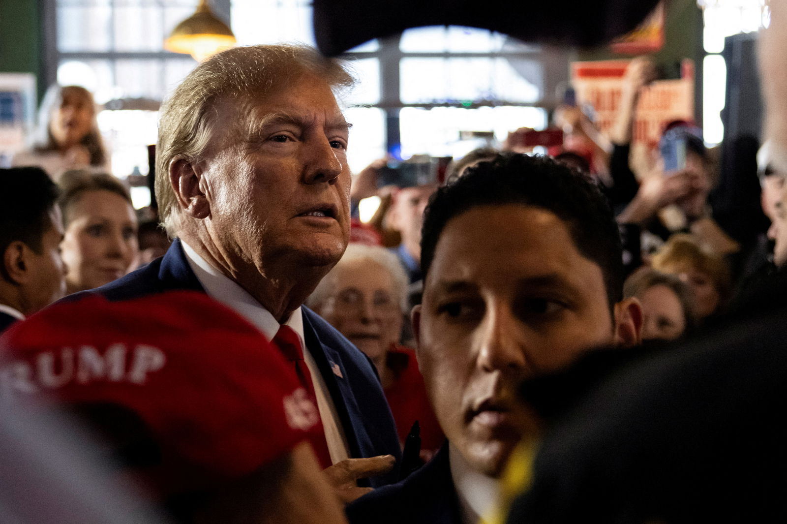 Former U.S. President and Republican presidential candidate Donald Trump rallies with supporters at a "commit to caucus" event at a Whiskey bar in Ankeny, Iowa, U.S. December 2, 2023. 