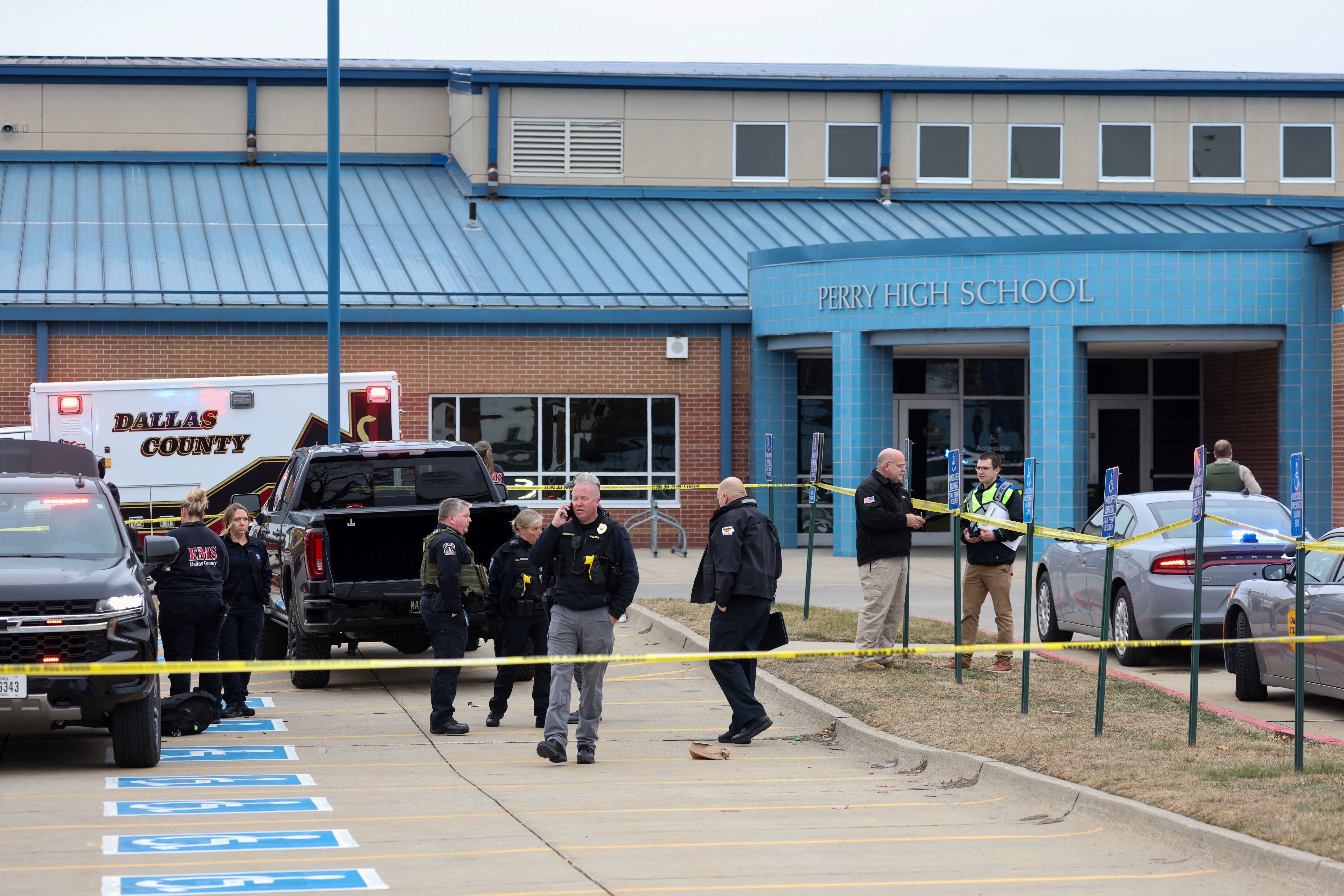 Law enforcement officers work at the scene of a shooting at Perry High School in Perry, Iowa, Jan. 4, 2024.