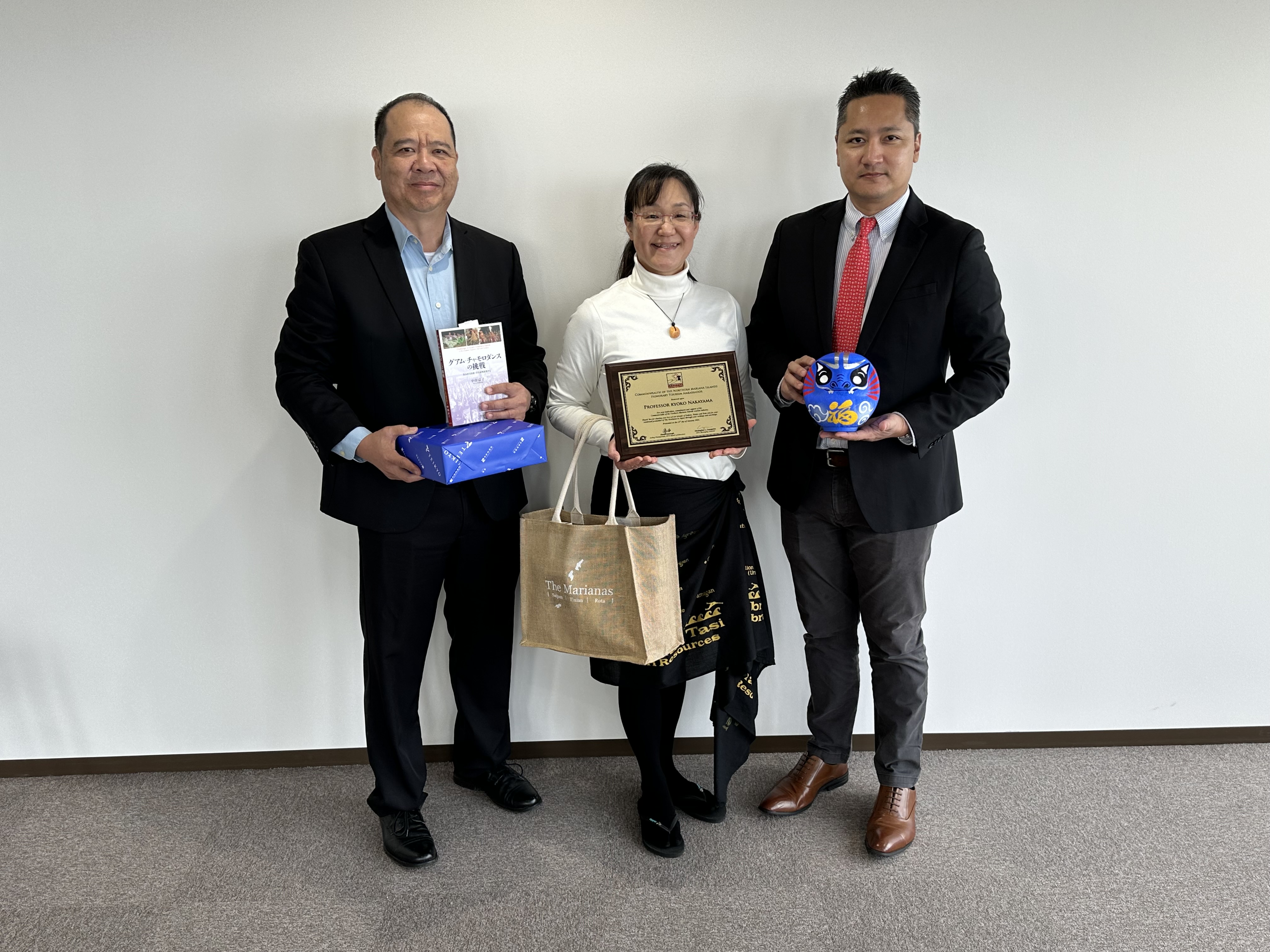 Teikyo University Professor Kyoko Nakayama, center, receives her plaque of appointment as Marianas honorary tourism ambassador on Jan. 23, 2024, in Tokyo, Japan, from Marianas Visitors Authority Managing Director Christopher  A.  Concepcion, right, and MVA Community  Projects  Manager Martin Duenas, left.
