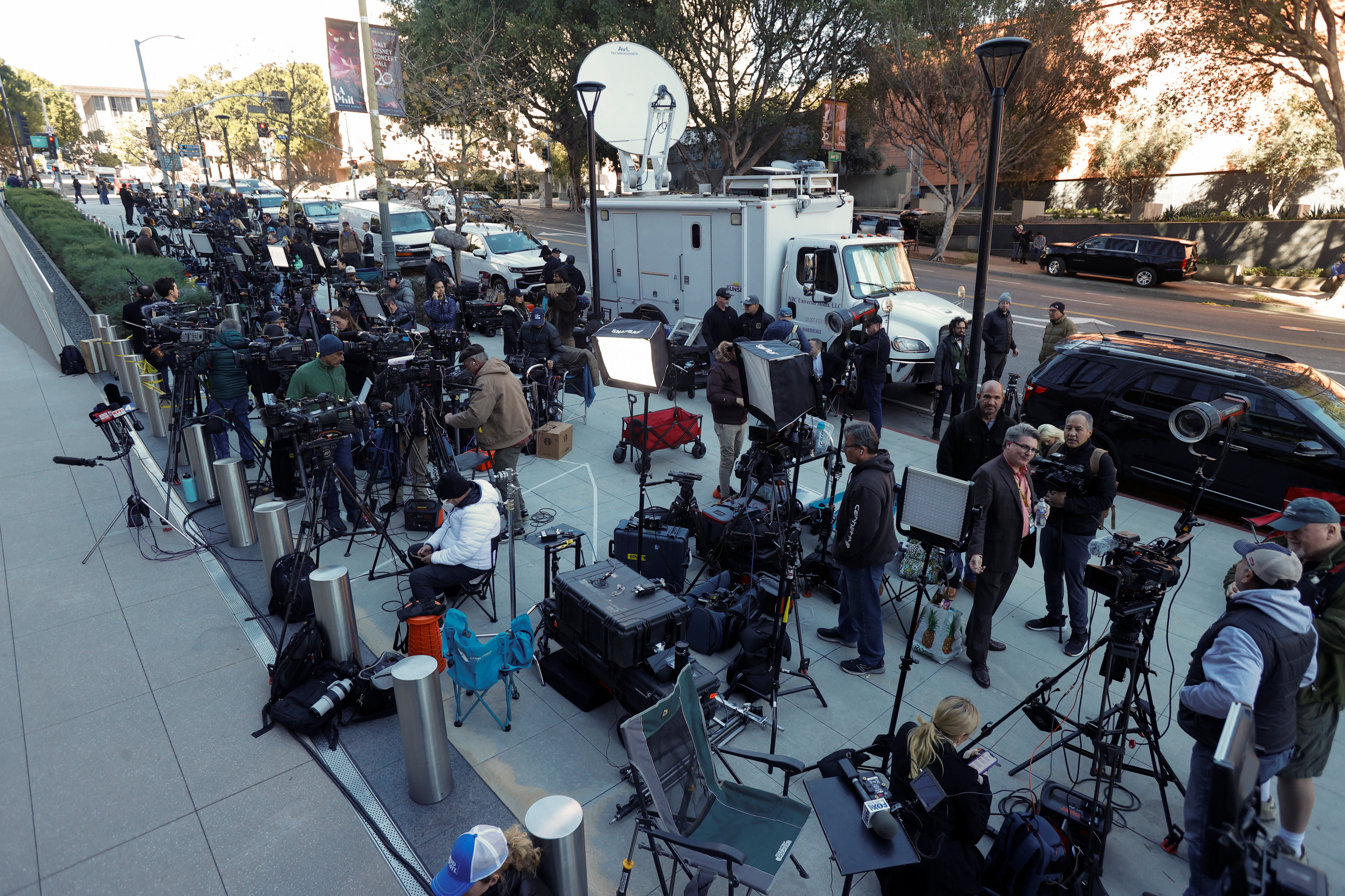 Members of the media gather outside a federal court where Hunter Biden, son of U.S. President Joe Biden, is expected to appear on tax charges, in Los Angeles, California, U.S., January 11, 2024. 