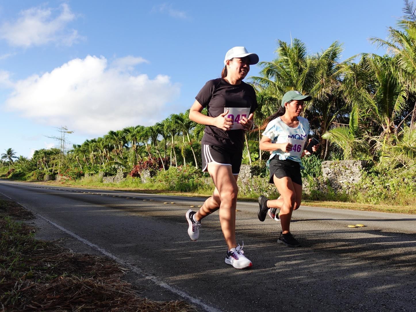 Marquit Chavez and Jane Malabanan of Saipan pass along a quiet and picturesque road during Rota Marathon 2024 on Jan. 13, 2024.