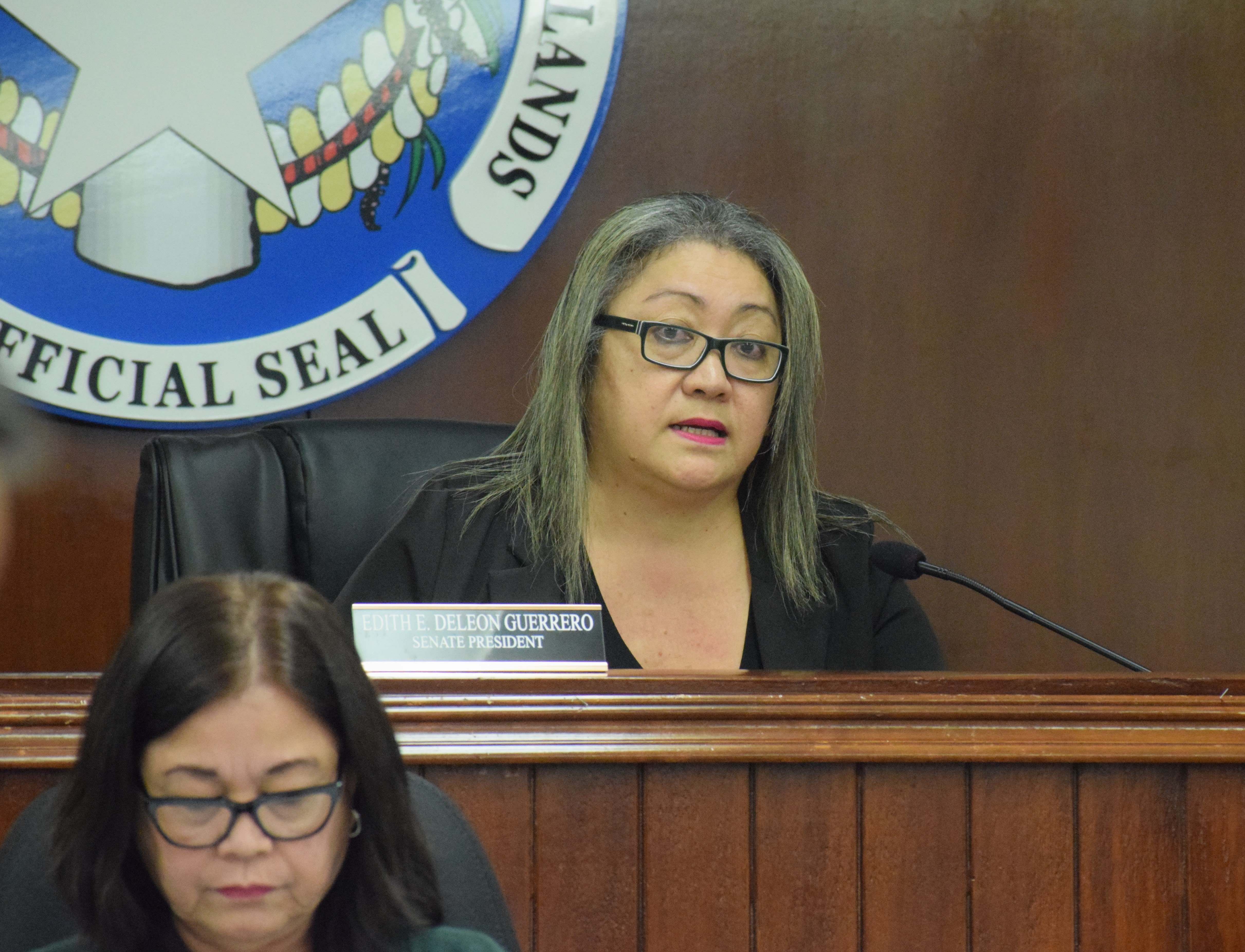 Senate President Edith Deleon Guerrero speaks during a session on Tuesday. Also in photo is Senate clerk Doris Bermudes.