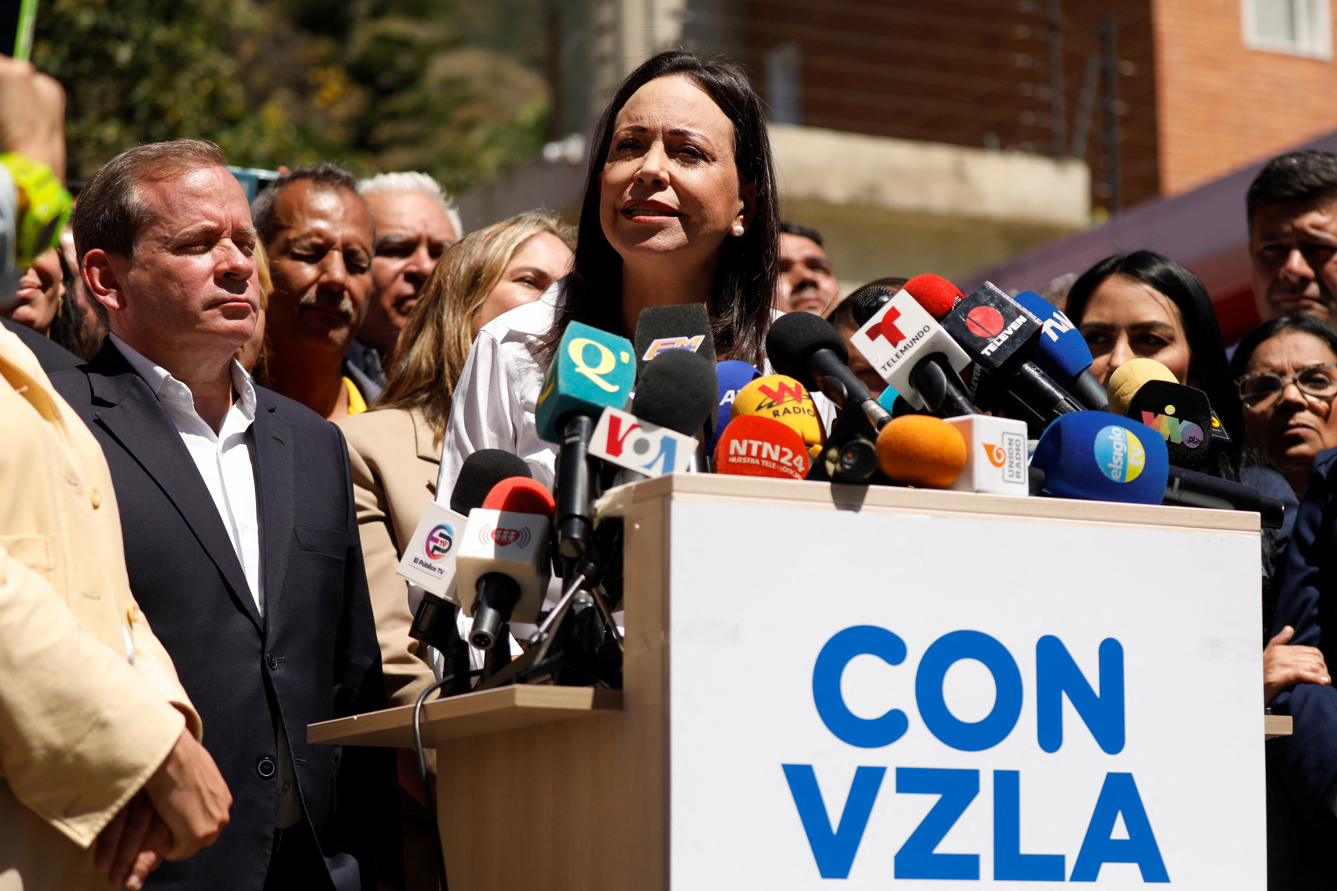 Venezuelan opposition presidential candidate Maria Corina Machado looks on as she addresses the media, after a court upheld a ban preventing her from holding office, in Caracas, Venezuela, January 29, 2024. 