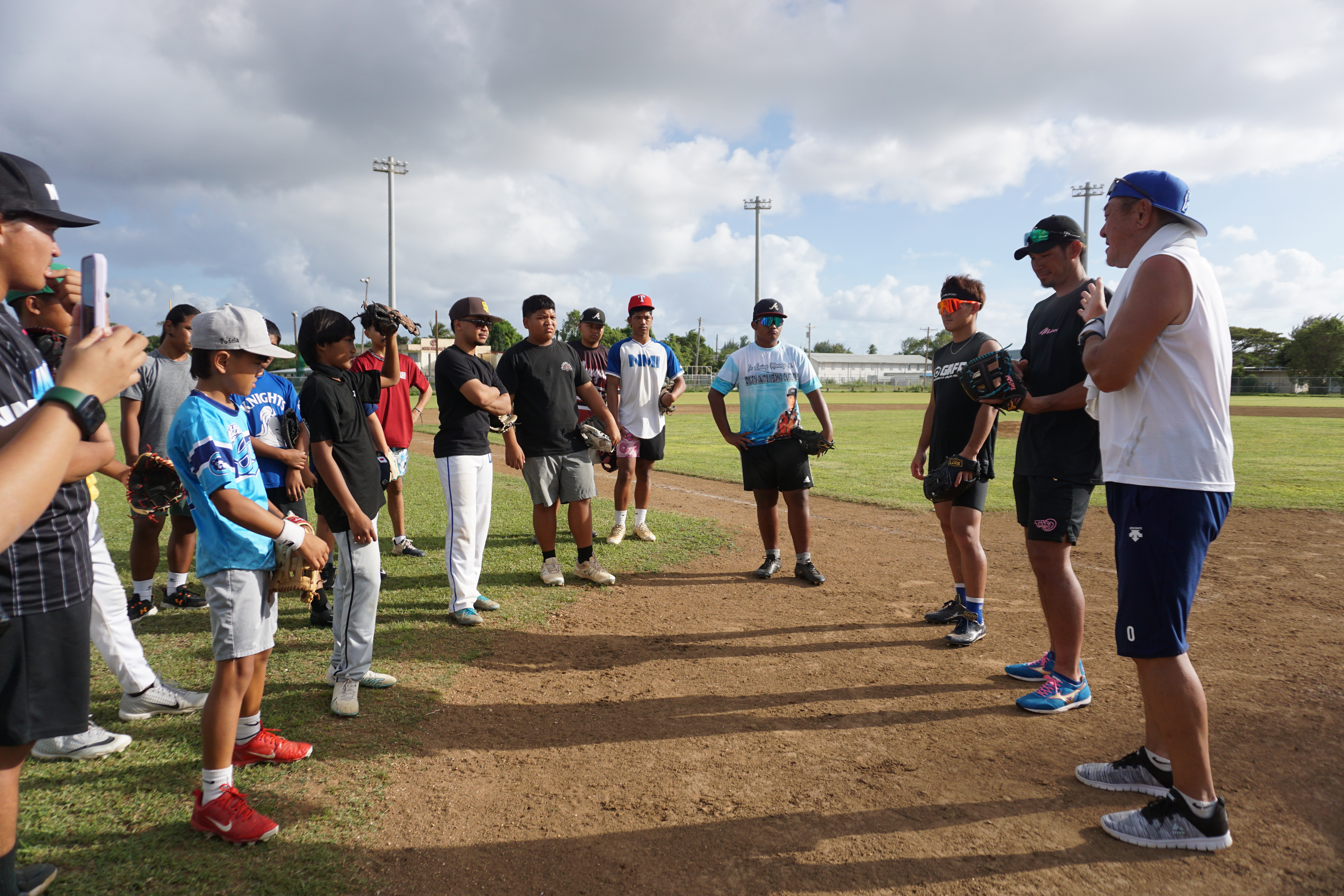 Japanese baseball players Takuma Hayashi, Taishi Ohta, with their manager/translator Eini Taniguchi, share some words with the participants of an hour-long baseball clinic at the Francisco “Tan Ko” Palacios Baseball Field on Saturday.