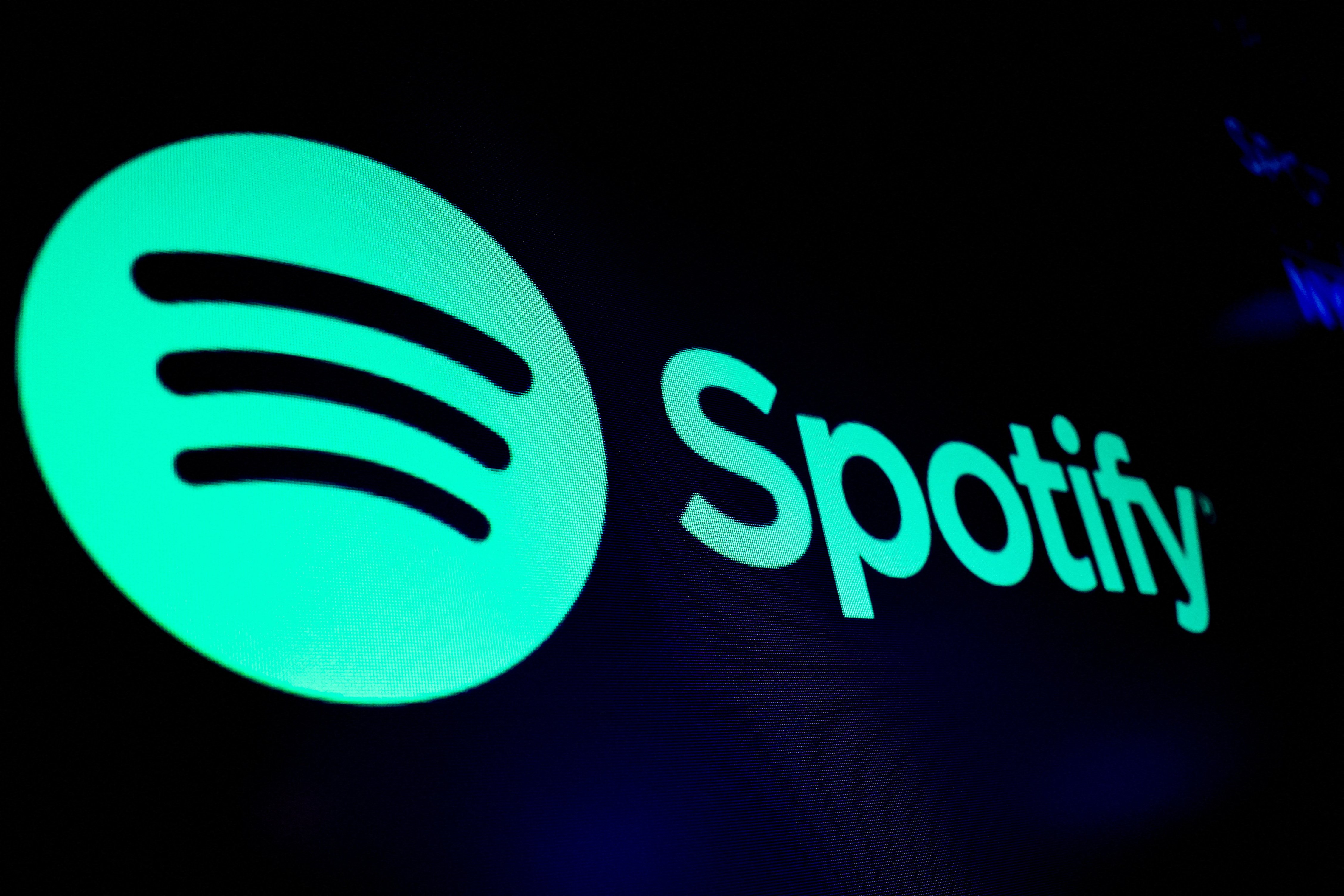 A screen displays the logo of Spotify on the floor at the New York Stock Exchange (NYSE) in New York City, U.S., December 4, 2023. 