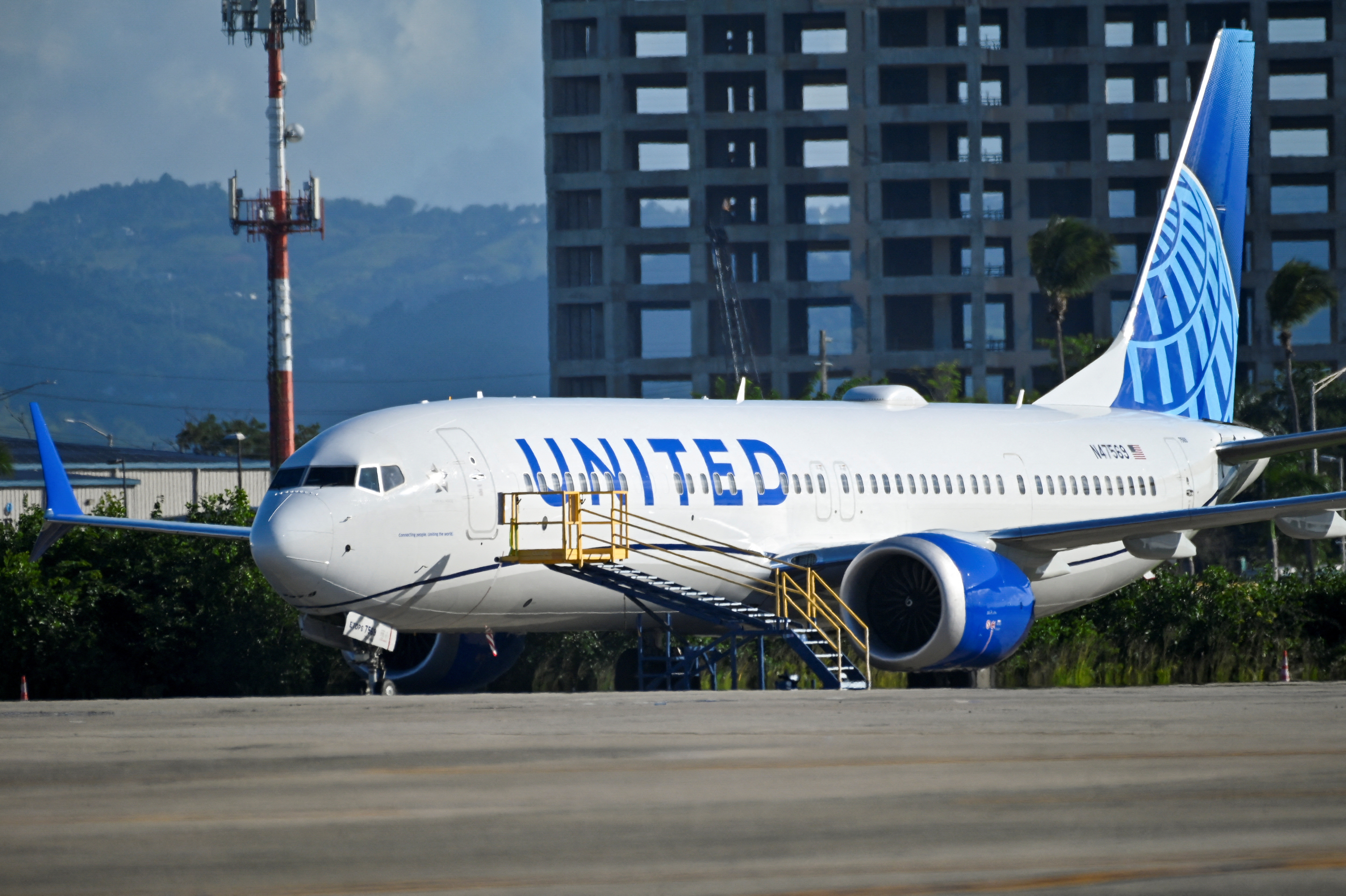 A United Airlines Boeing 737 MAX 9 jetliner is grounded as passengers try to rebook their tickets from canceled United Airlines flights after U.S. air safety regulator the Federal Aviation Administration grounded 171 Boeing 737 MAX 9 jetliners for safety checks because of the emergency landing of an Alaska Airlines plane, at Luis Munoz Marin International Airport in San Juan, Puerto Rico, Jan. 7, 2024.