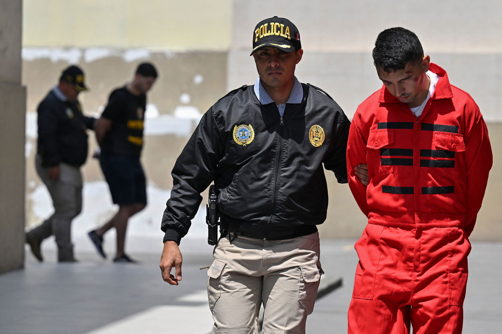Peruvian police carry out the transfer of several members of the Tren de Aragua criminal organization in Lima, Peru, on Oct. 5, 2023. 