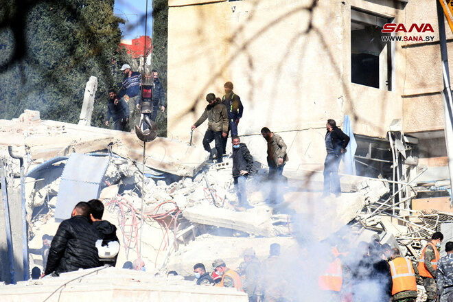 People inspect the damage at the site of an Israeli strike, according to sources, in the Mazzeh neighborhood of Damascus, Syria January 20, 2024. 