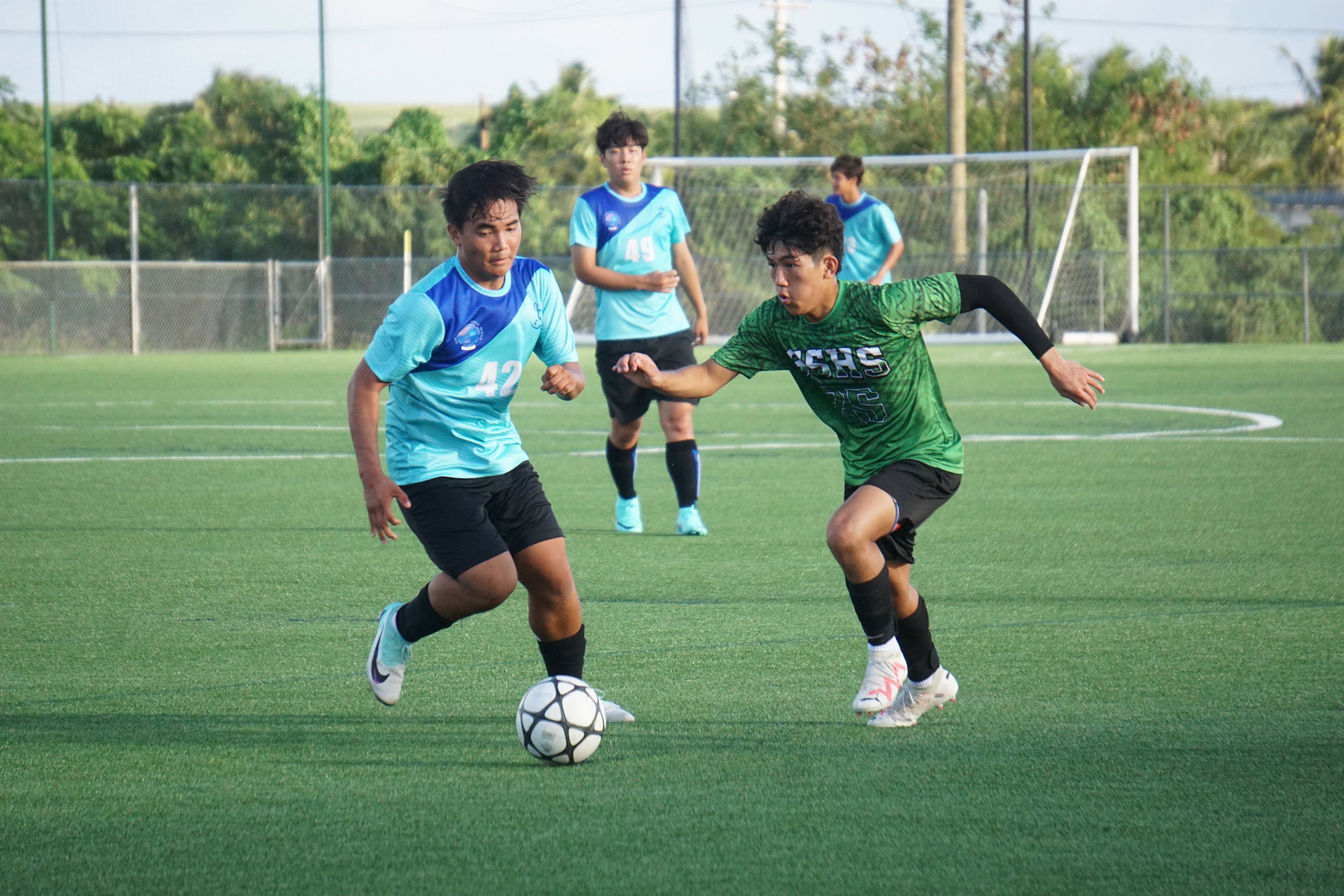 SSHS' Jonald Gutierrez and SIS' Casey Chambers chase after the loose ball during a boys high school division semifinal match of the NMIFA-PSS Interscholastic Soccer League SY23-24 at the NMI Soccer Training Center in Koblerville on Tuesday.